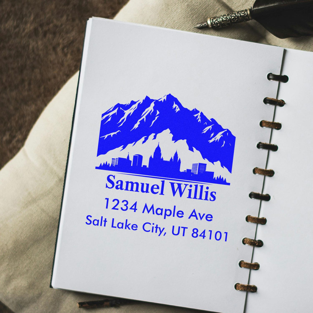 Personalized address rubber stamp with mountain skyline design for Samuel Willis, Salt Lake City, UT 84101.