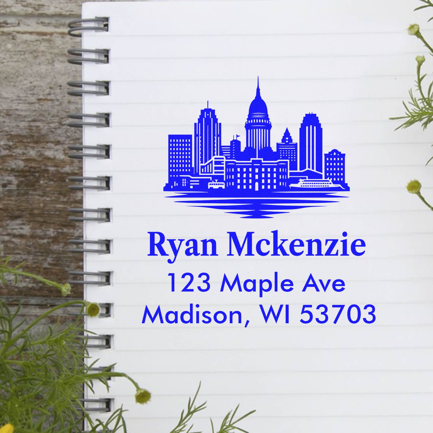 Custom return address rubber stamp with city skyline for Ryan Mckenzie, 123 Maple Ave, Madison, WI 53703
