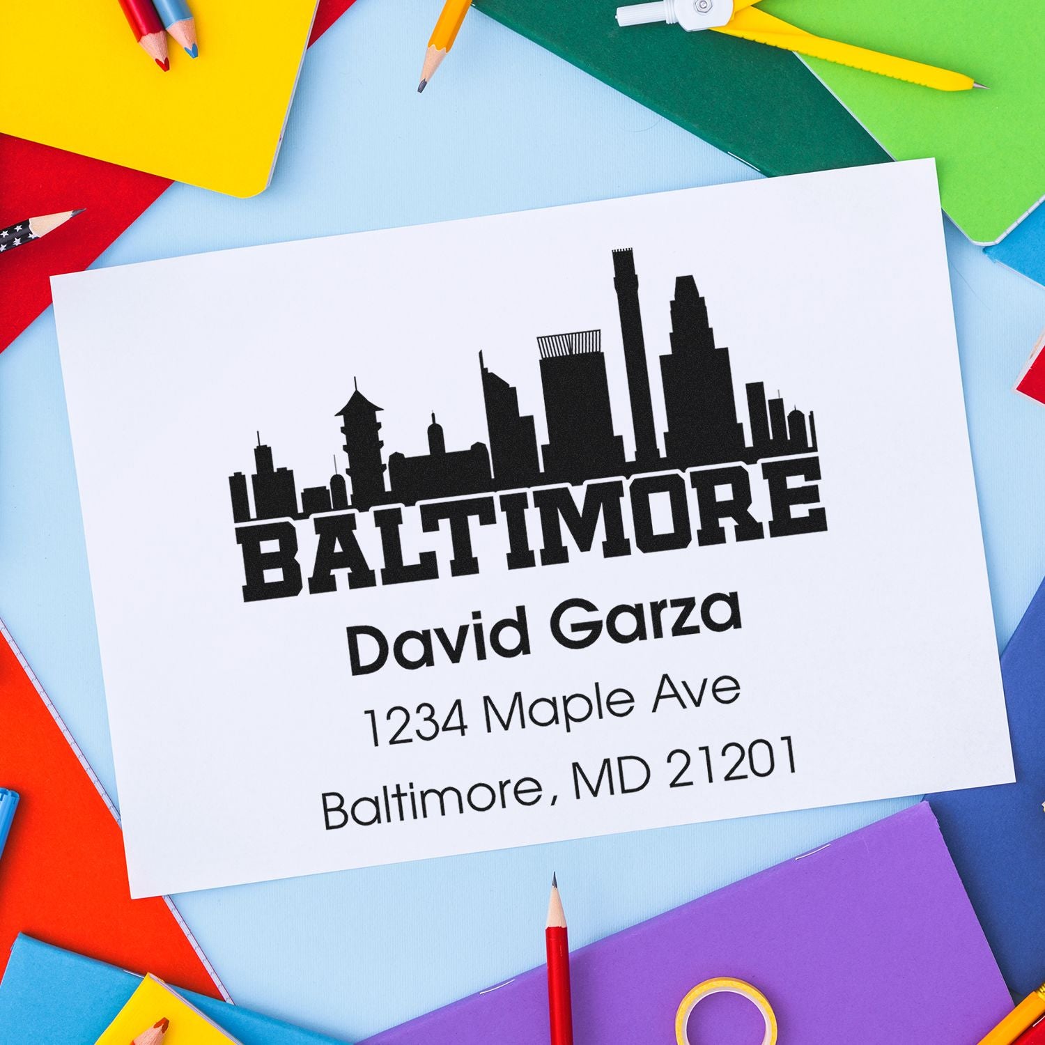 Custom Baltimore return address rubber stamp with skyline design, personalized name and address for mailing.