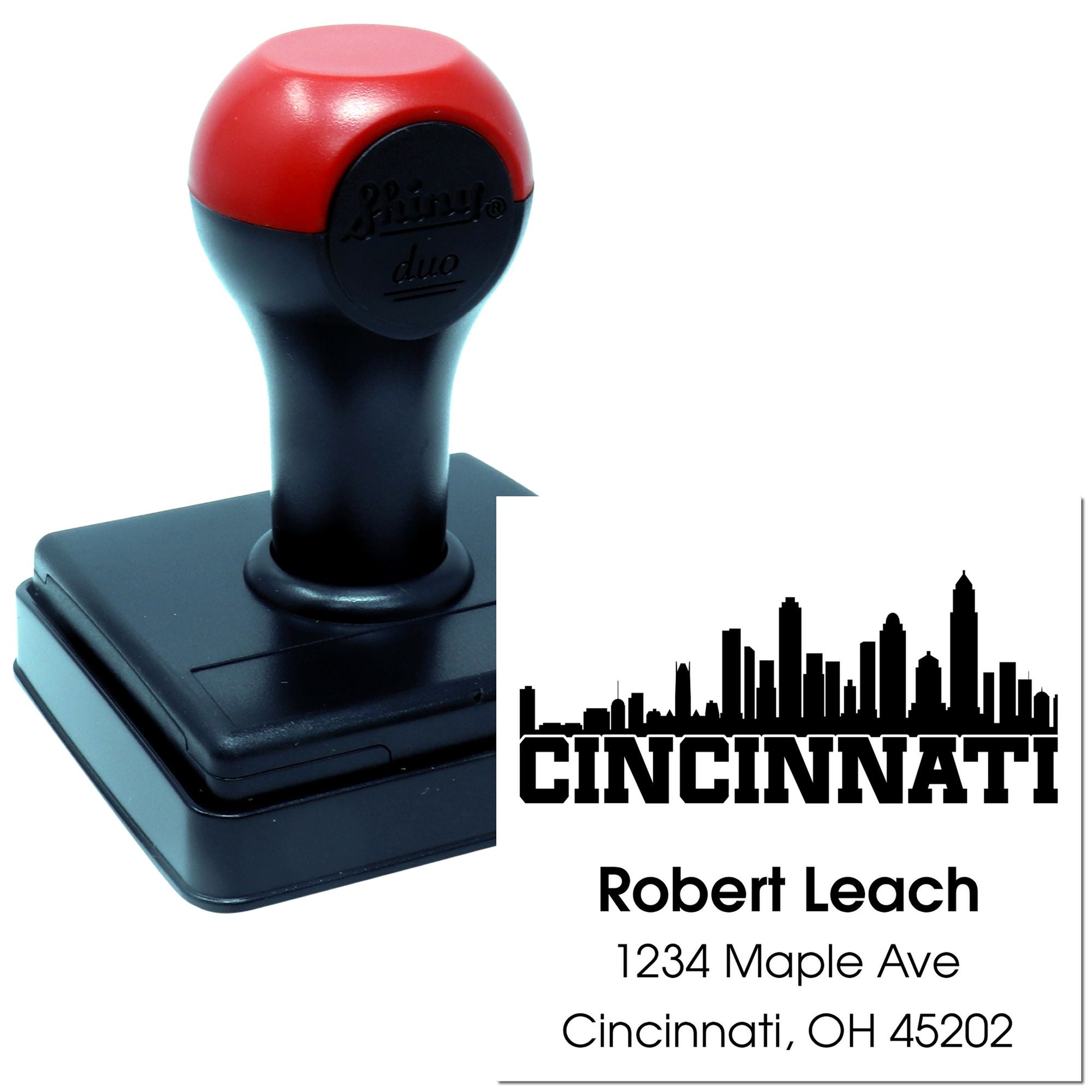 Custom self-inking rubber stamp with Cincinnati skyline address design and personalized name and address imprint.