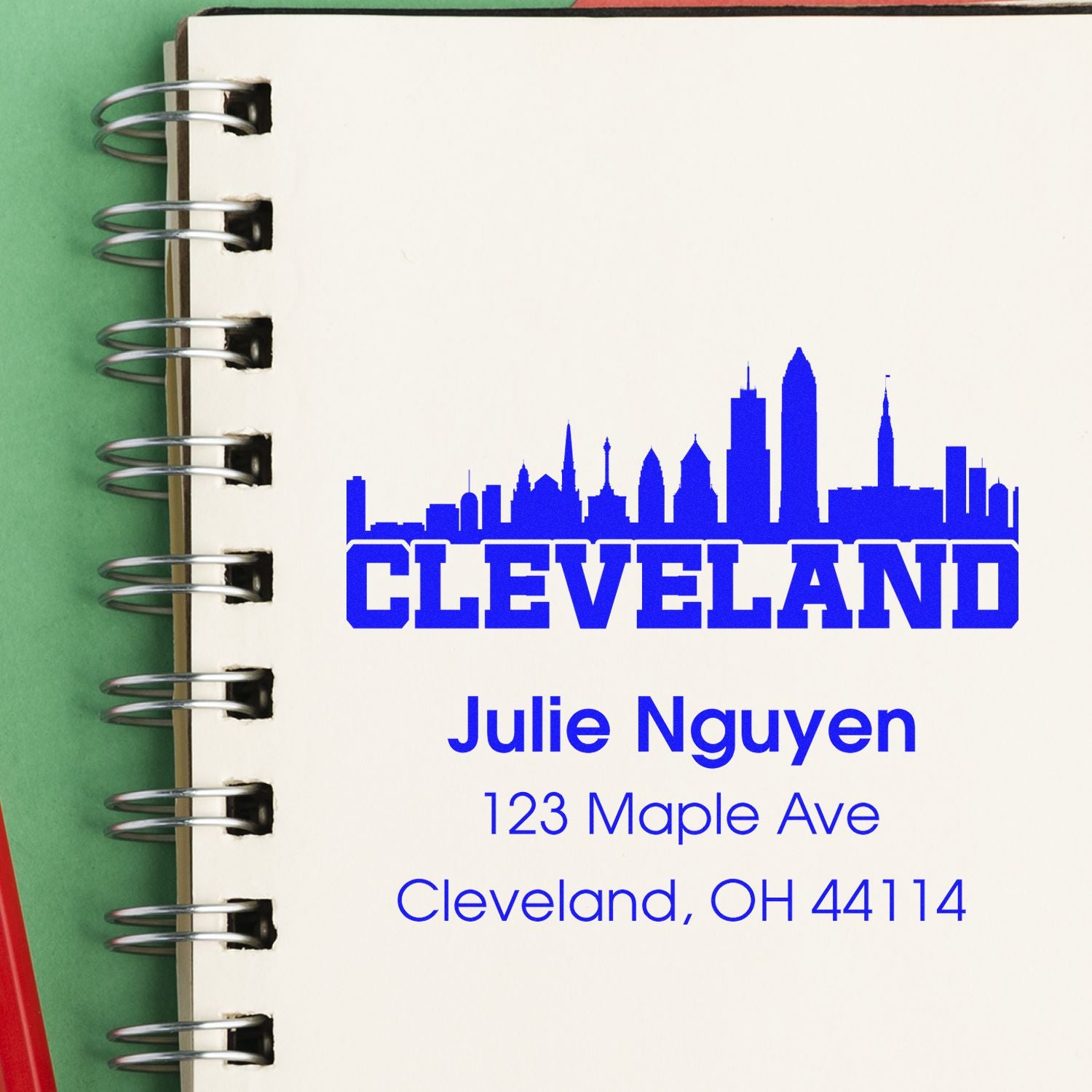 Custom Cleveland address rubber stamp with skyline design, name, and address for personal stationery.