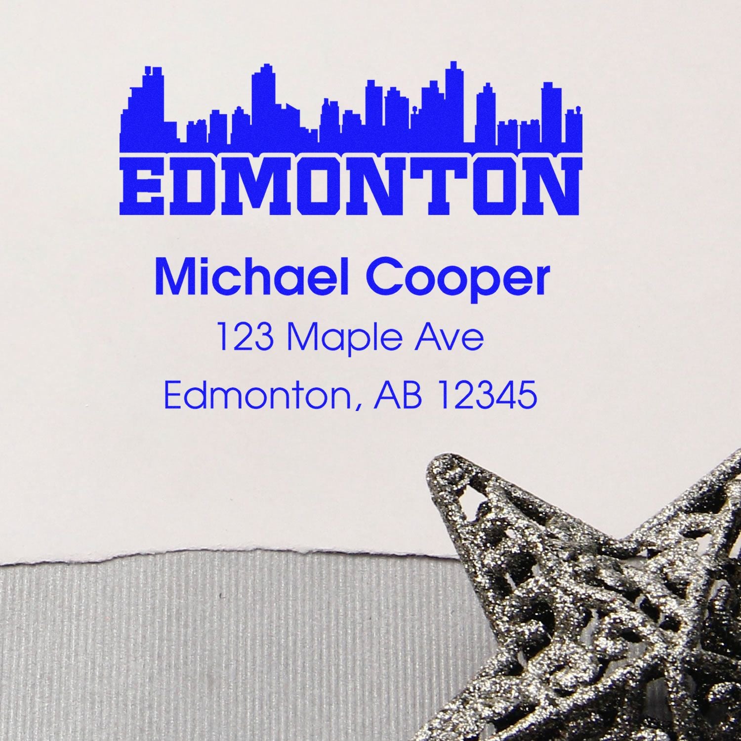 Edmonton skyline custom address rubber stamp with Michael Cooper, 123 Maple Ave, Edmonton, AB 12345.