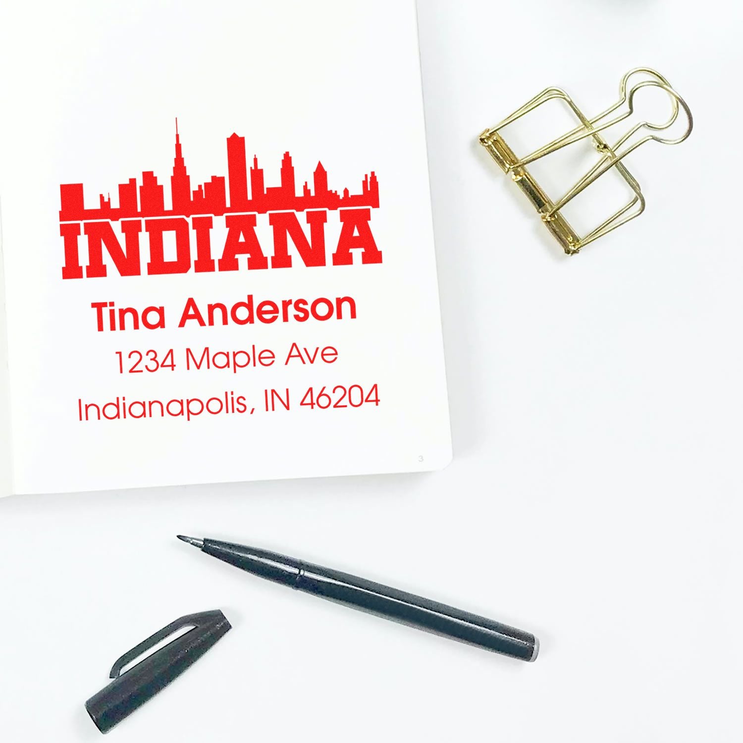 Custom Indiana return address rubber stamp with skyline design for Tina Anderson, Indianapolis, IN 46204.