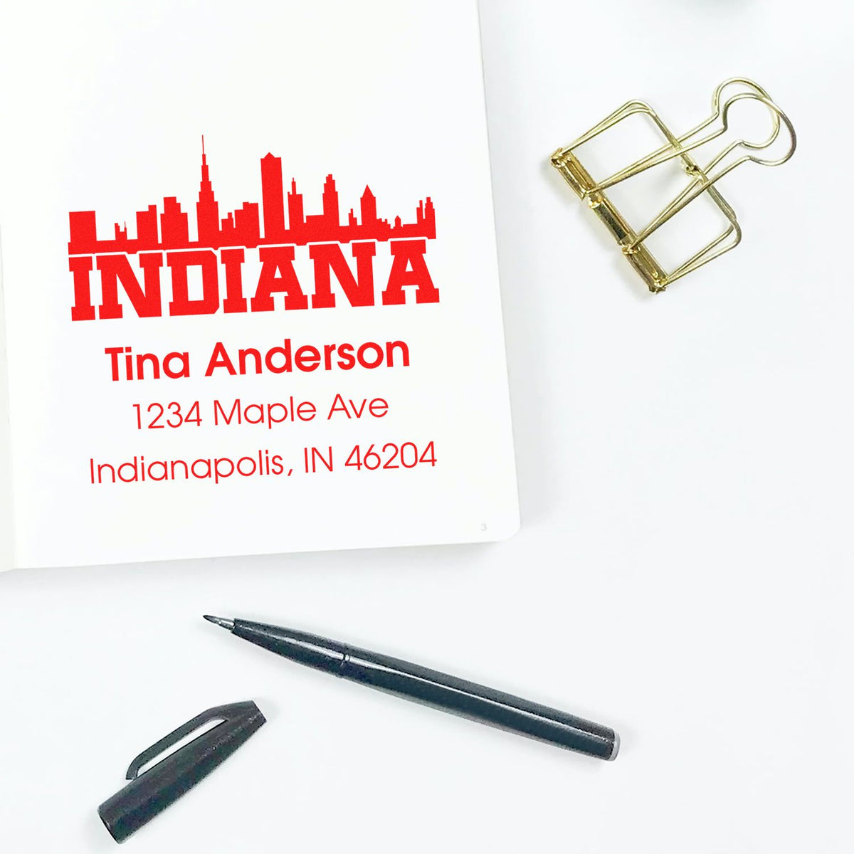 Custom Indiana address rubber stamp design proof with skyline, Tina Anderson name, and Indianapolis, IN mailing address.
