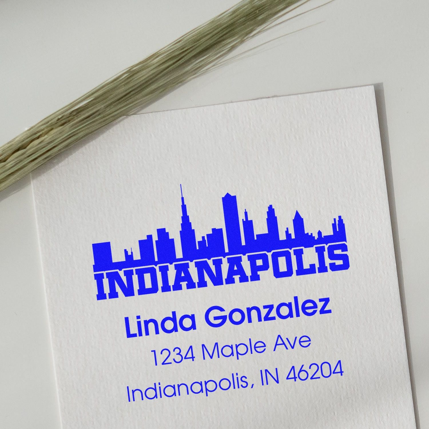 Custom Indianapolis address rubber stamp with skyline design for Linda Gonzalez, 1234 Maple Ave, Indianapolis, IN 46204.