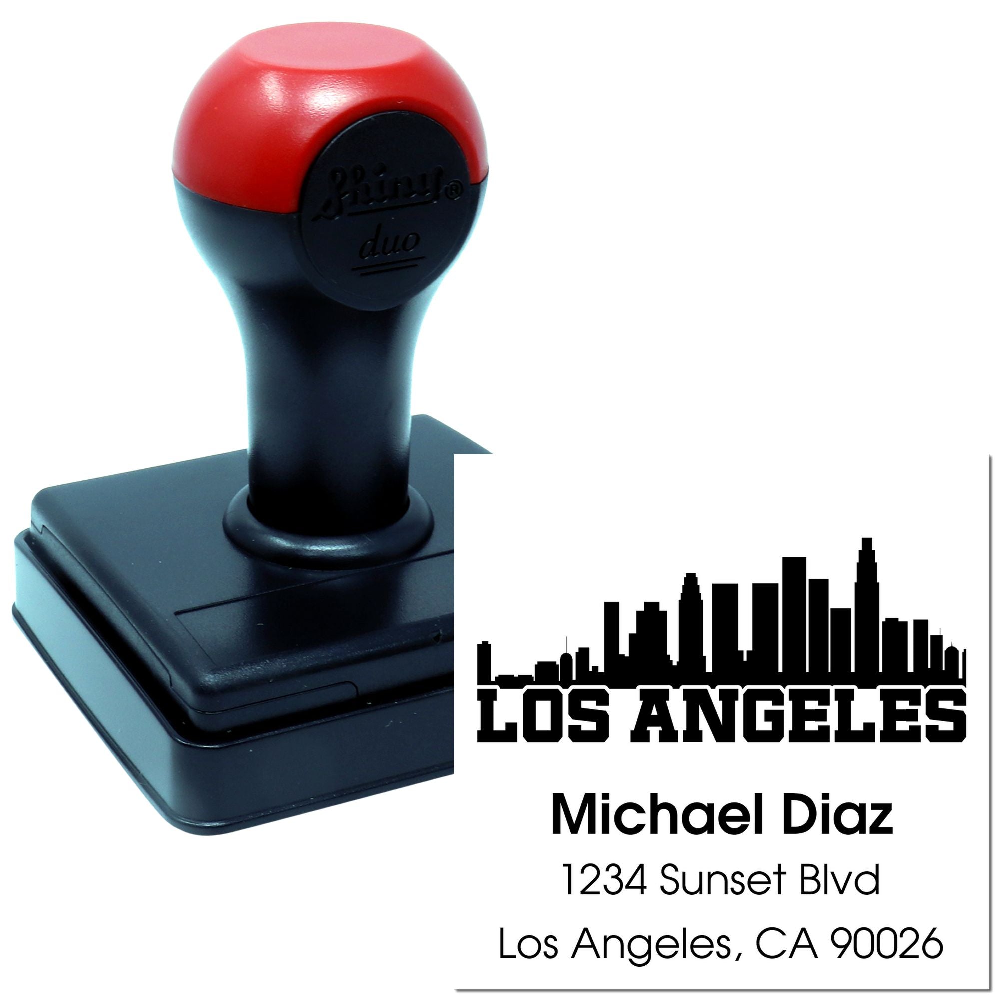Custom self-inking rubber stamp with Los Angeles skyline, personalized name, and return address for business mailings.