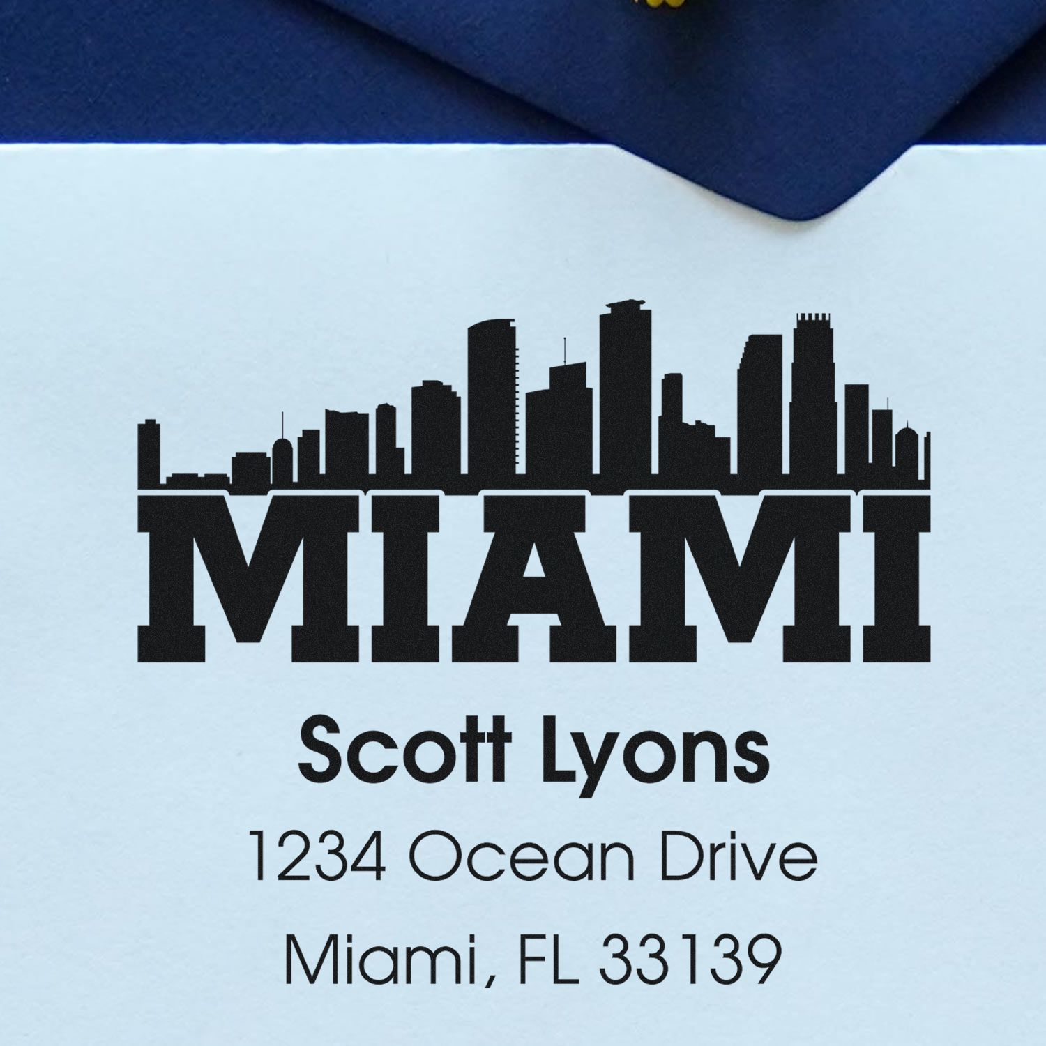 Custom Miami skyline address rubber stamp with Scott Lyons, 1234 Ocean Drive, Miami, FL 33139.