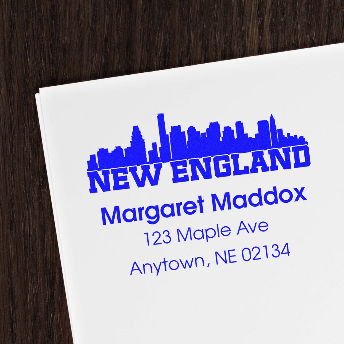 Personalized New England address rubber stamp with skyline design for mailing, business branding, and custom envelopes.