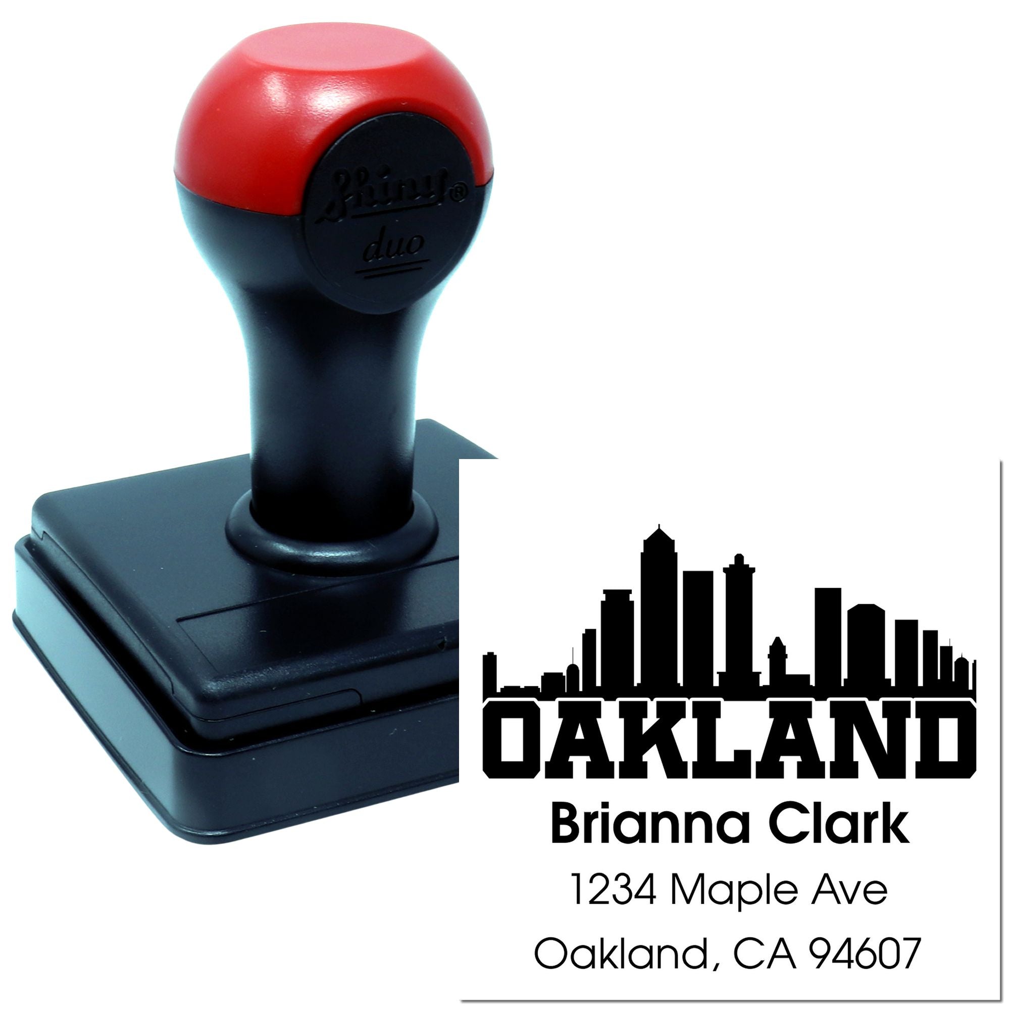 Custom self-inking rubber address stamp with Oakland skyline, Brianna Clark name, and Oakland, CA 94607.