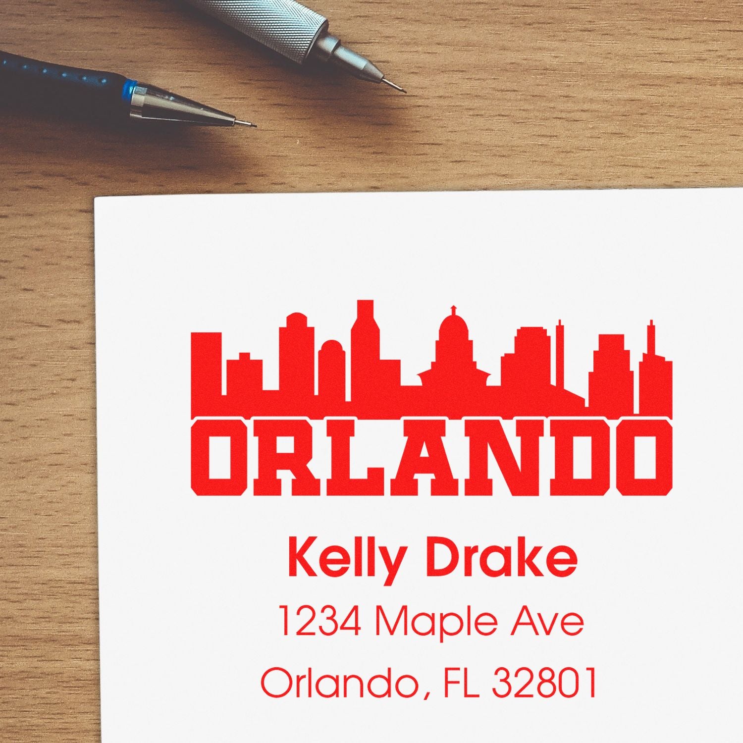 Custom Orlando address rubber stamp with skyline logo, name, and mailing address for personalized business or mail labeling.