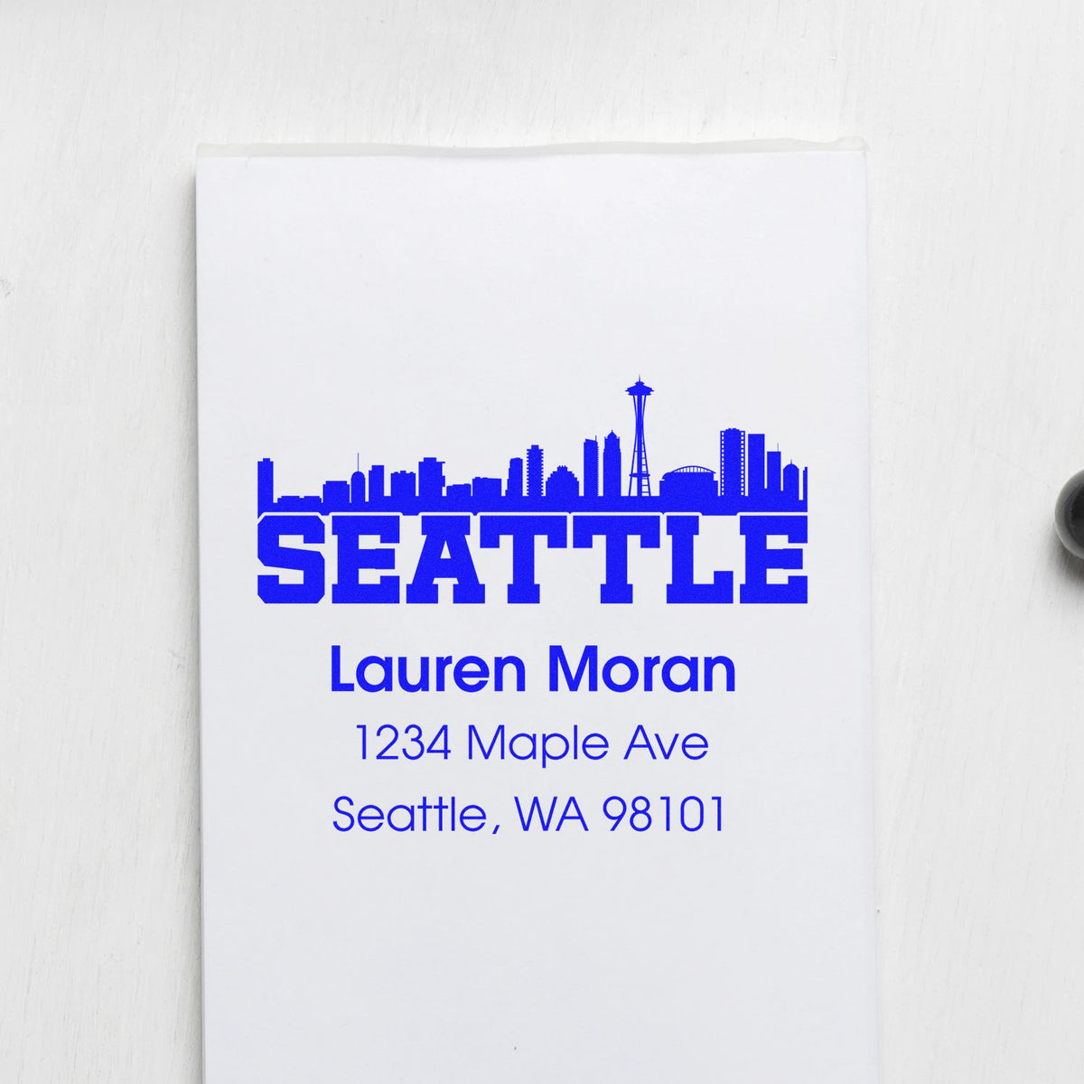 Seattle skyline custom return address rubber stamp for Lauren Moran with personalized name and Seattle, WA 98101 address.