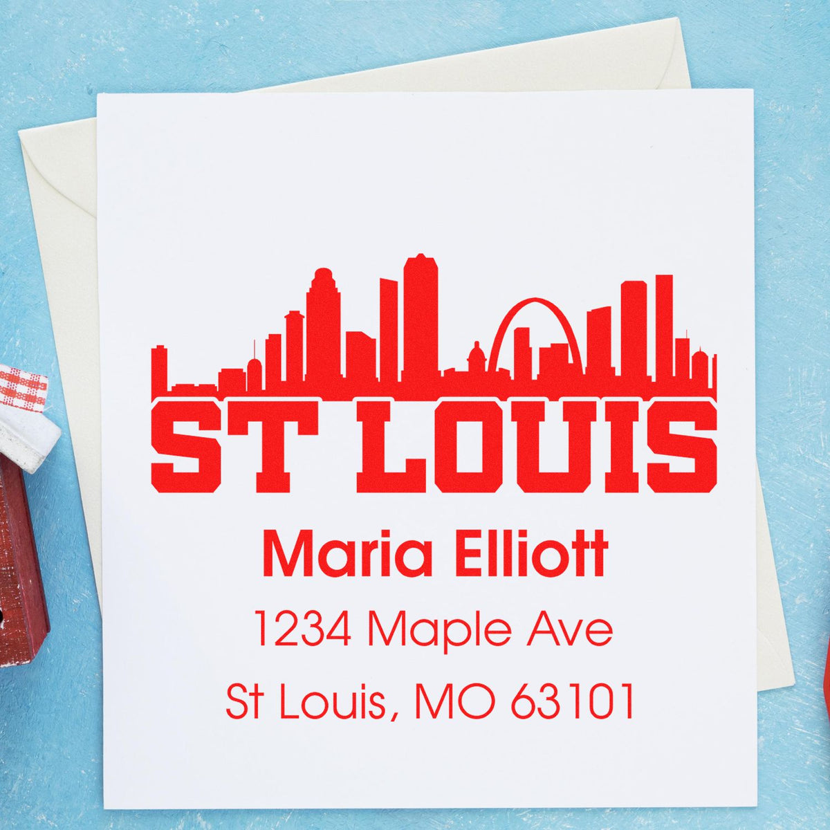 Custom St. Louis skyline return address rubber stamp with name, street address, and ZIP code for Maria Elliott.
