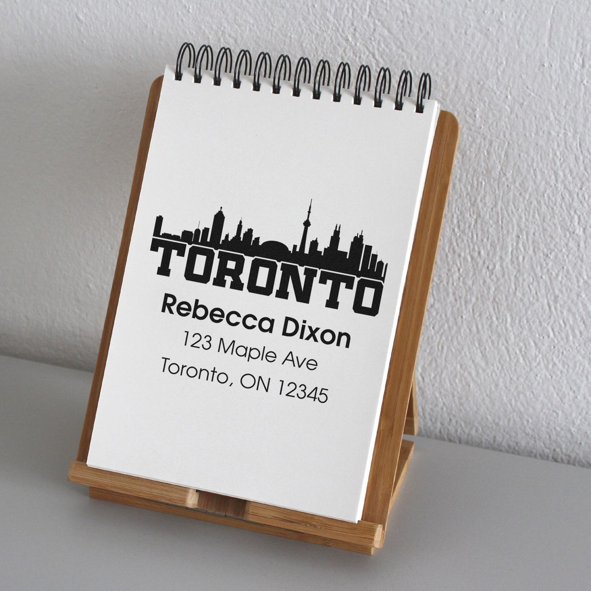 Personalized Toronto skyline return address rubber stamp with Rebecca Dixon name and mailing address.