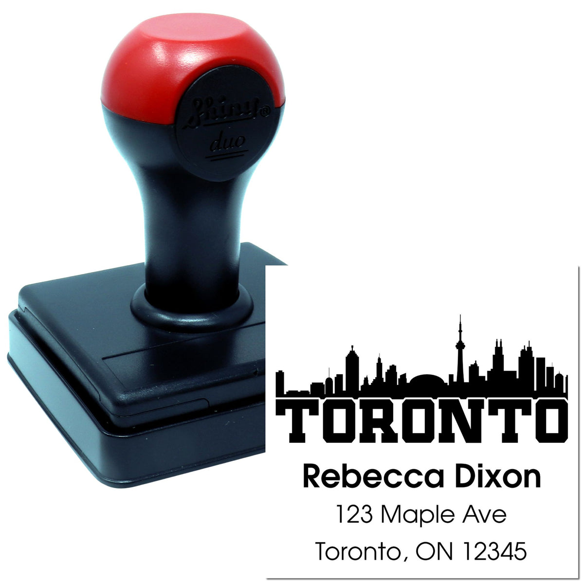 Self-inking Toronto return address rubber stamp with skyline, personalized for Rebecca Dixon at 123 Maple Ave.