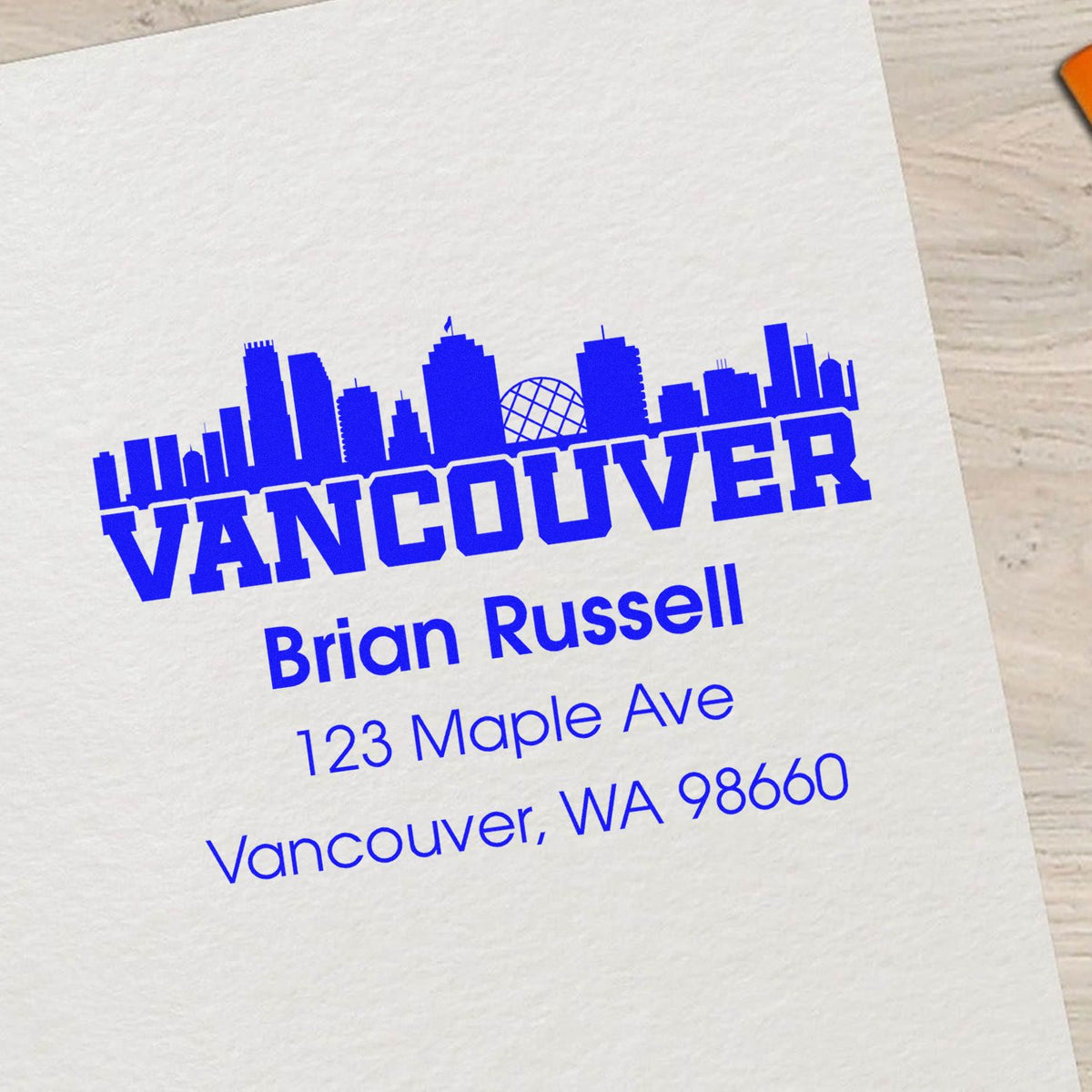 Custom Vancouver rubber stamp with skyline and return address for Brian Russell, 123 Maple Ave, Vancouver, WA 98660.
