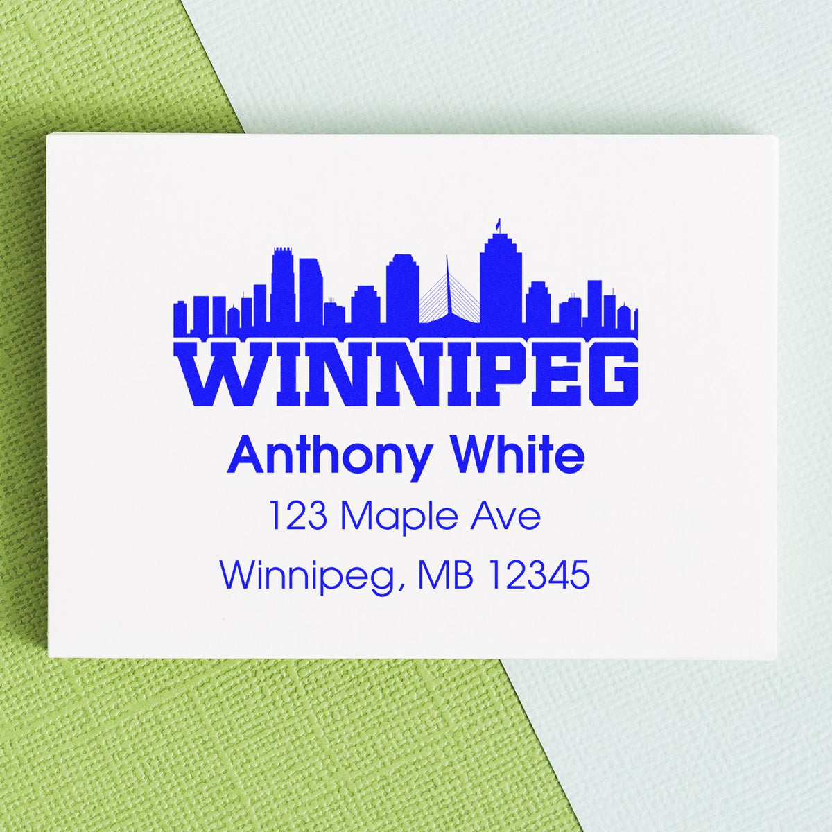 Custom Winnipeg return address rubber stamp with skyline, Anthony White name, and mailing address