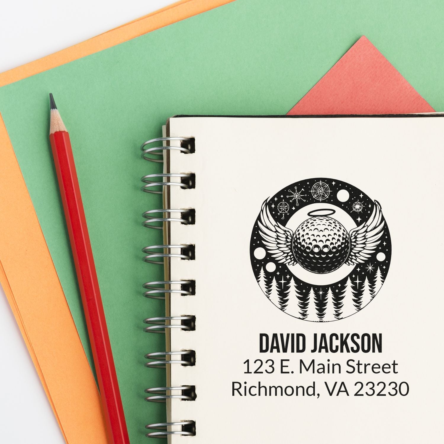 Custom rubber address stamp with golf ball and wings logo, printed on notebook; personalized for David Jackson, Richmond, VA.
