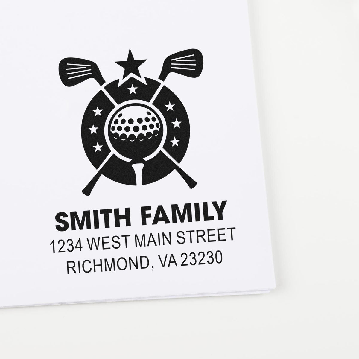 Custom golf rubber stamp with family name and address, featuring crossed clubs and golf ball design.