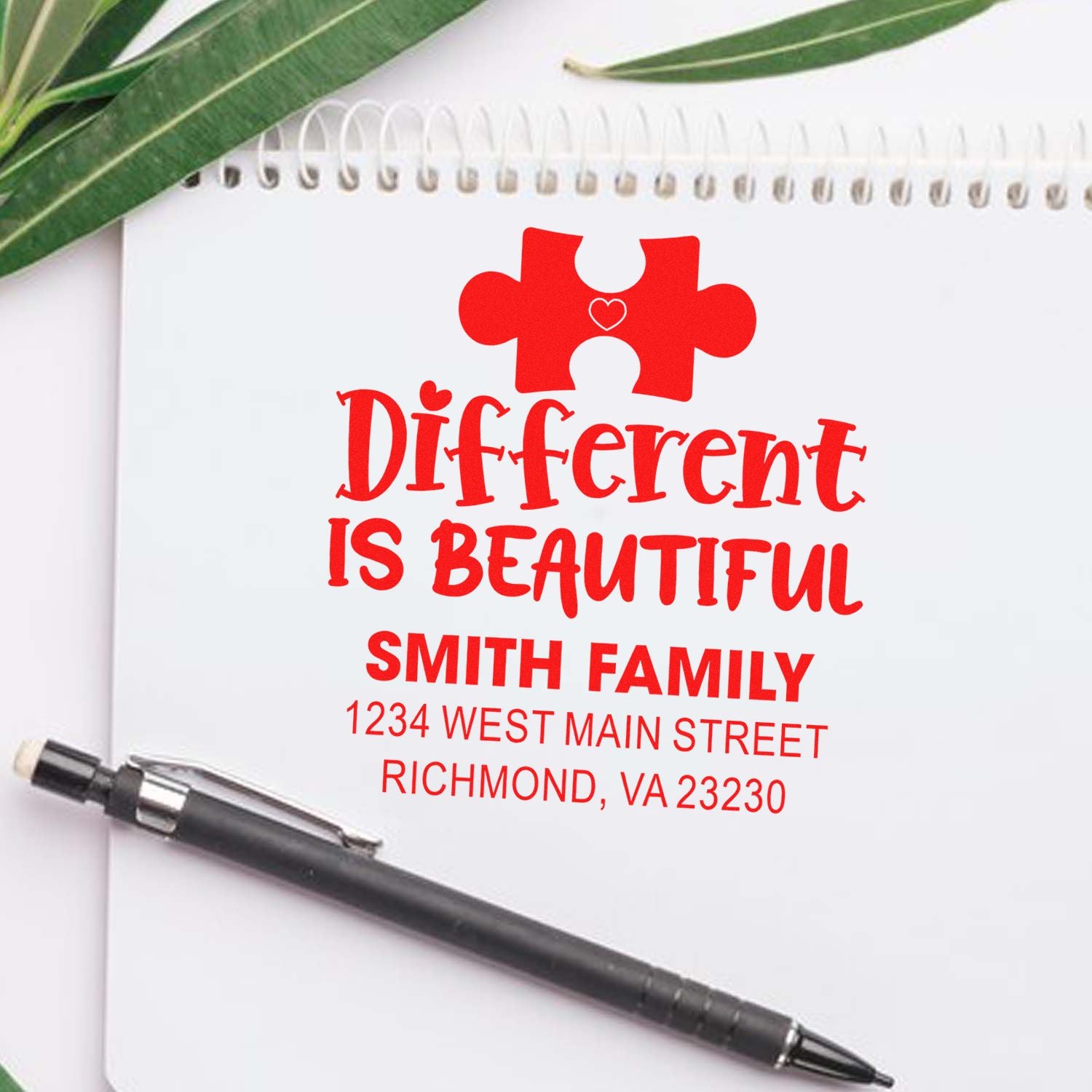 Custom personalized rubber stamp with puzzle piece design, Different Is Beautiful, and Smith family address for mailing.