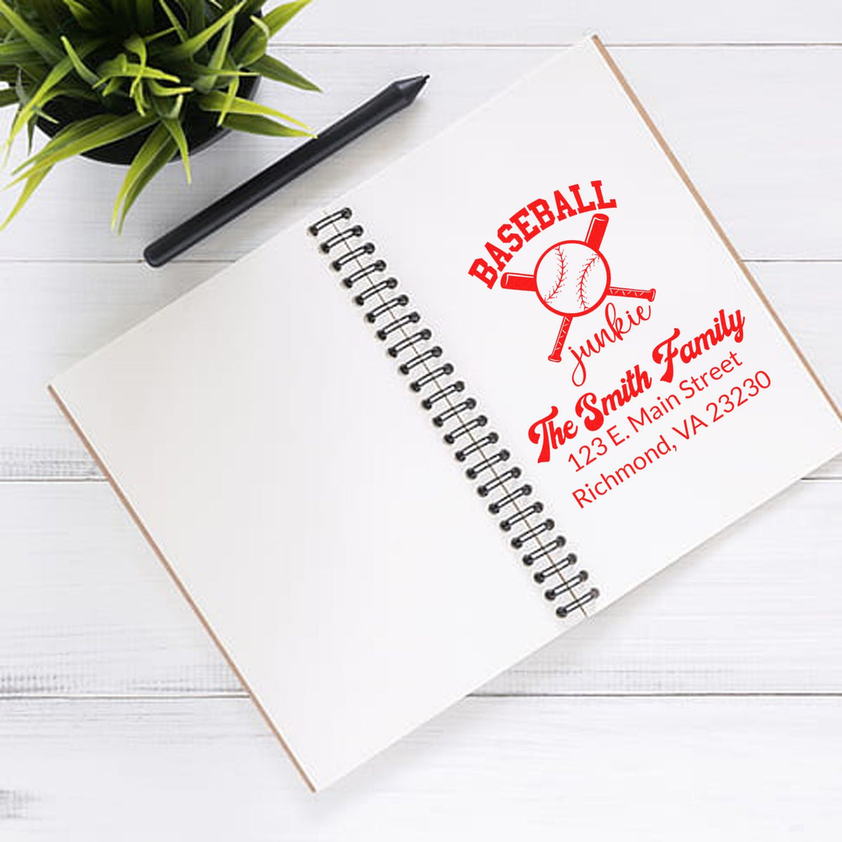 Custom baseball family address rubber stamp sample on notebook, personalized with name and Richmond, VA address.