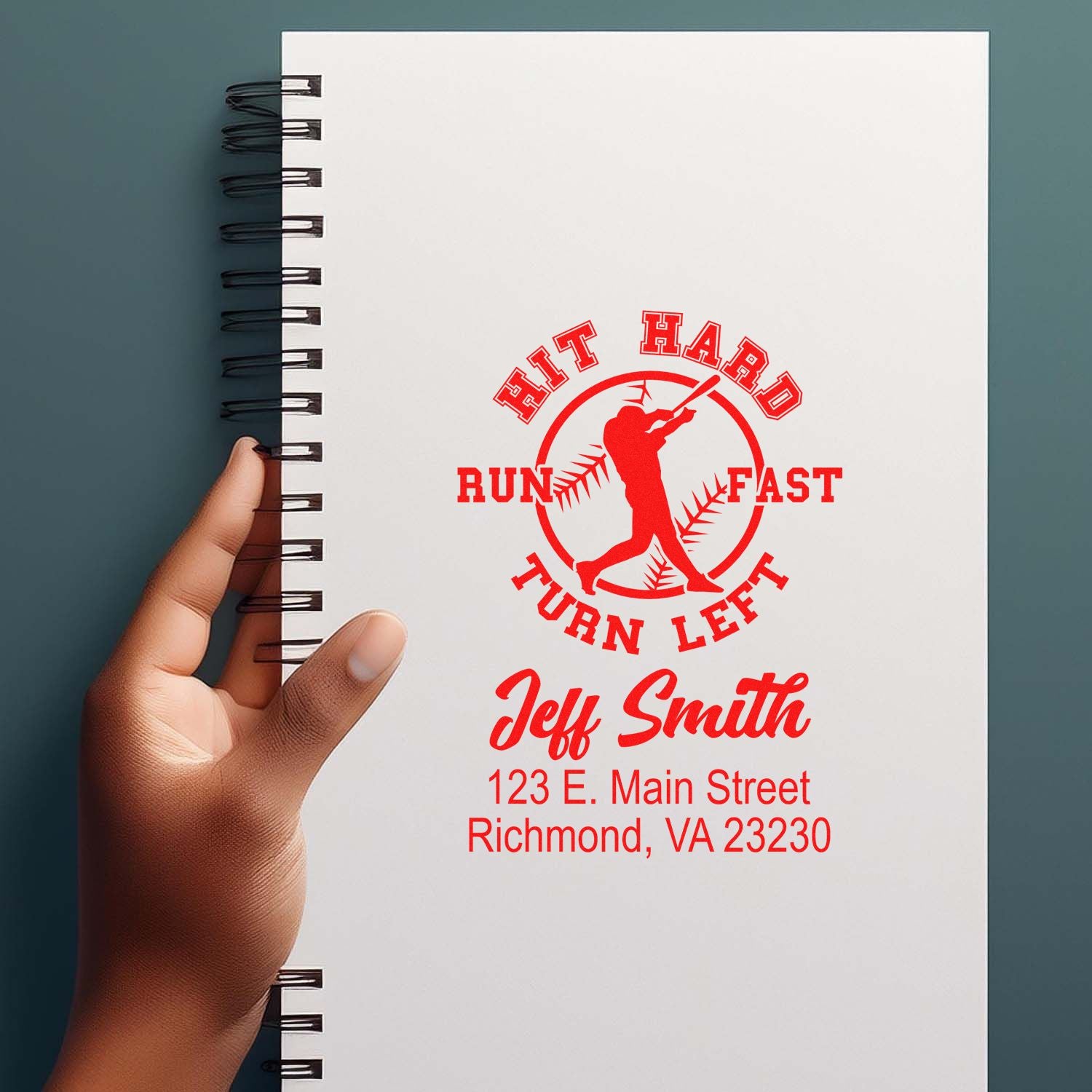 Custom baseball rubber stamp mockup on notebook with Hit Hard Run Fast Turn Left and Jeff Smith address.