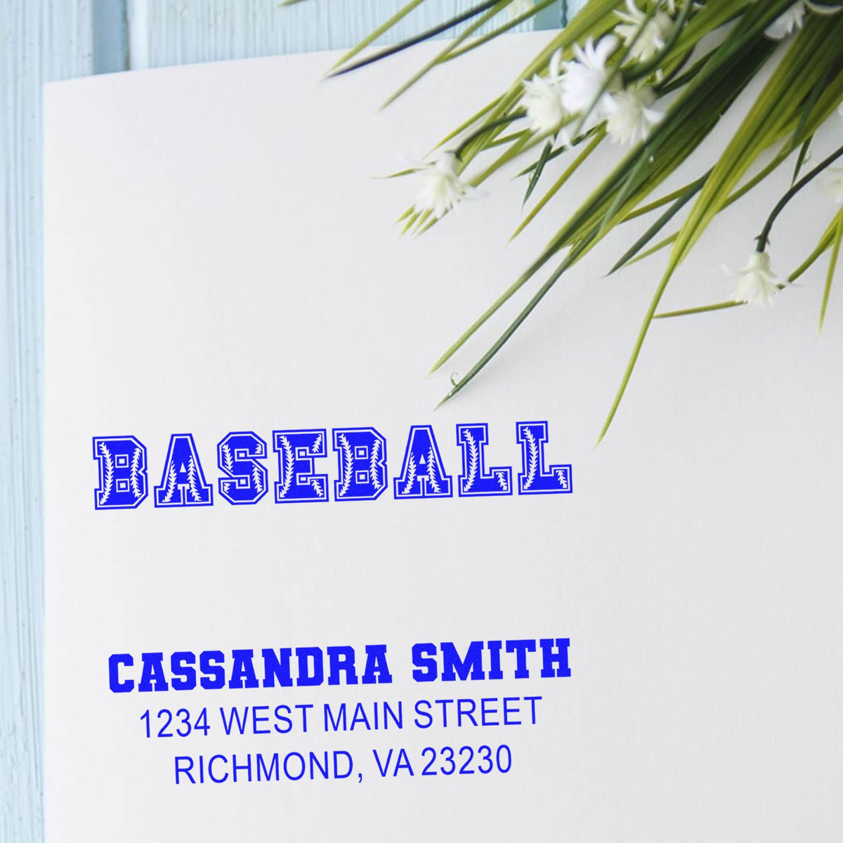 Custom baseball address rubber stamp with name and return address for envelopes, featuring bold blue BASEBALL design.