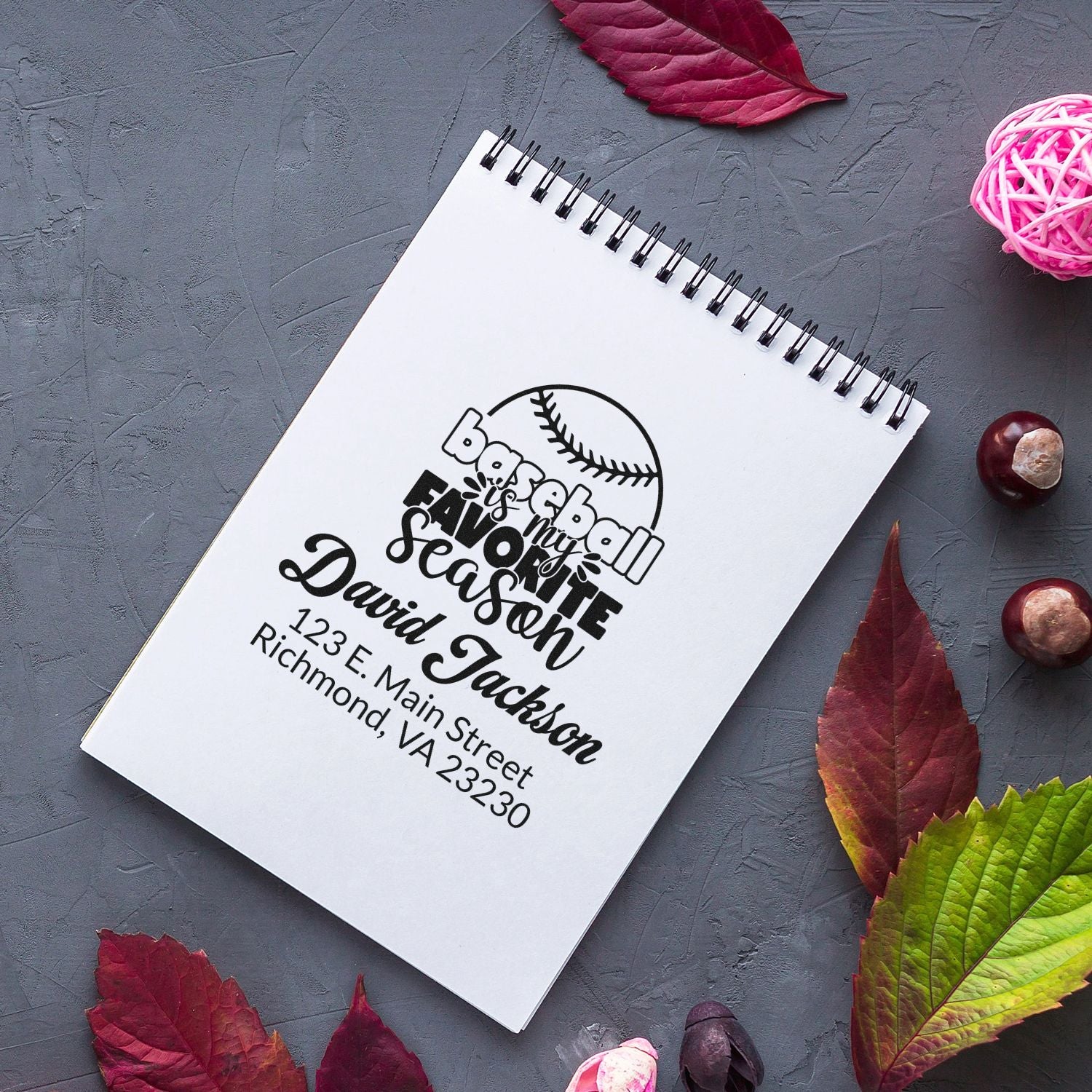 Custom baseball address rubber stamp design on notebook, featuring personalized name, address, and favorite season graphic.