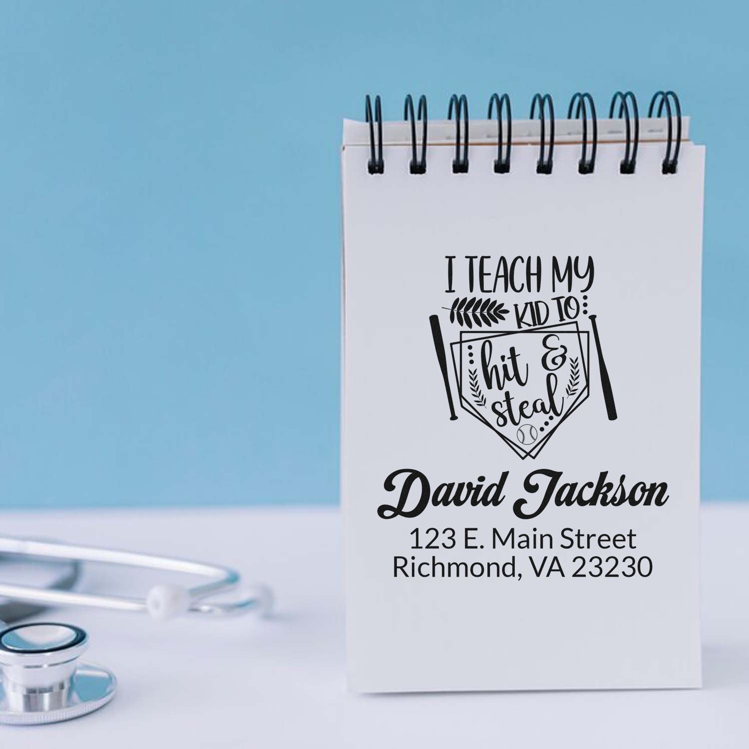 Custom baseball teacher rubber stamp with personalized name and return address on notepad mockup.