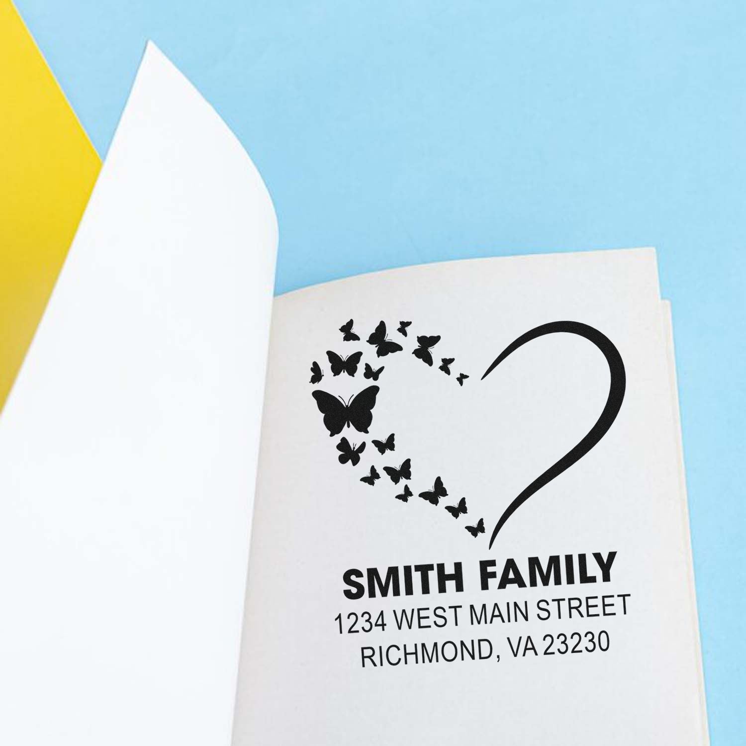 Custom butterfly heart return address rubber stamp for family mail, personalized with name and address.
