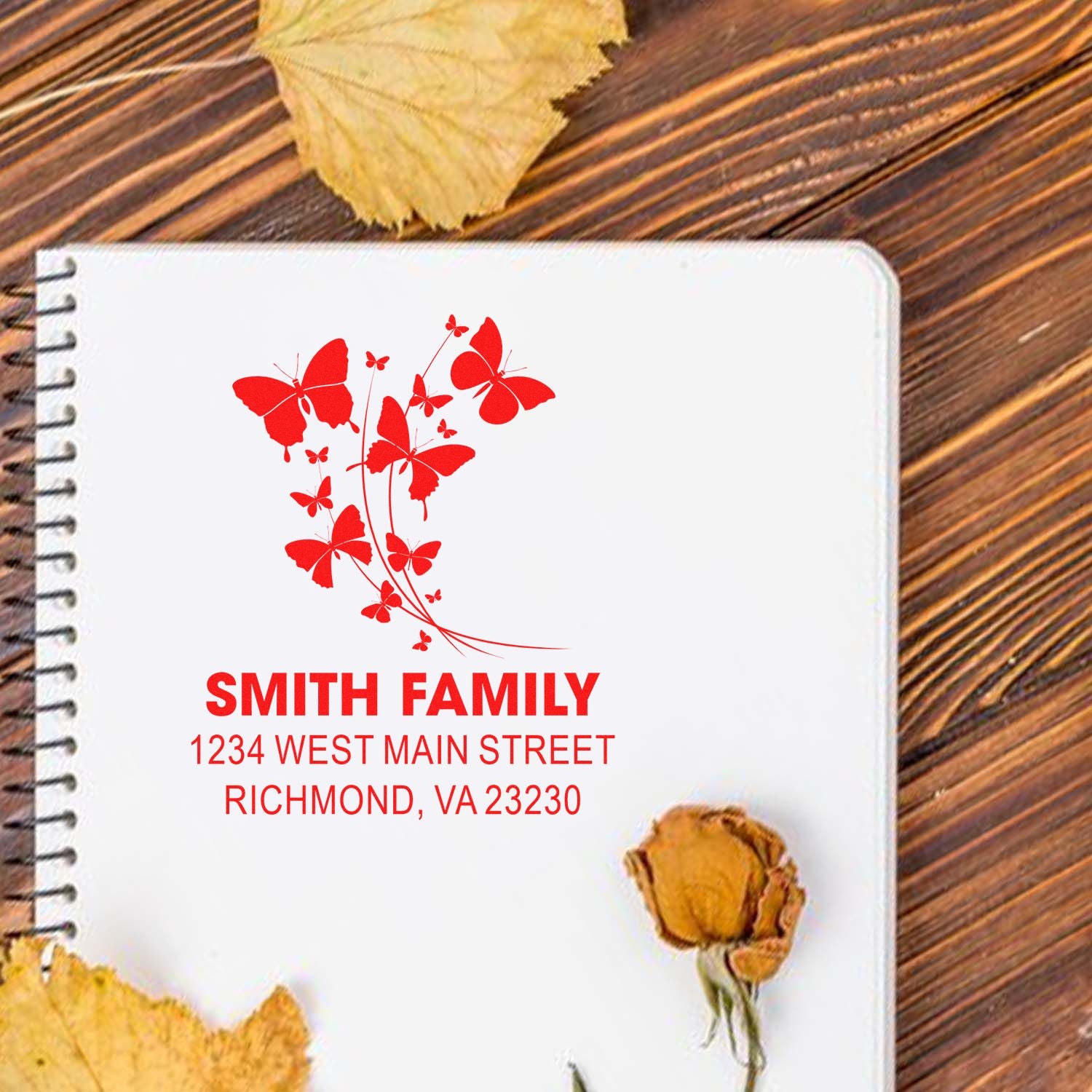 Custom butterfly family address rubber stamp for Smith Family, with red floral design and Richmond, VA address.