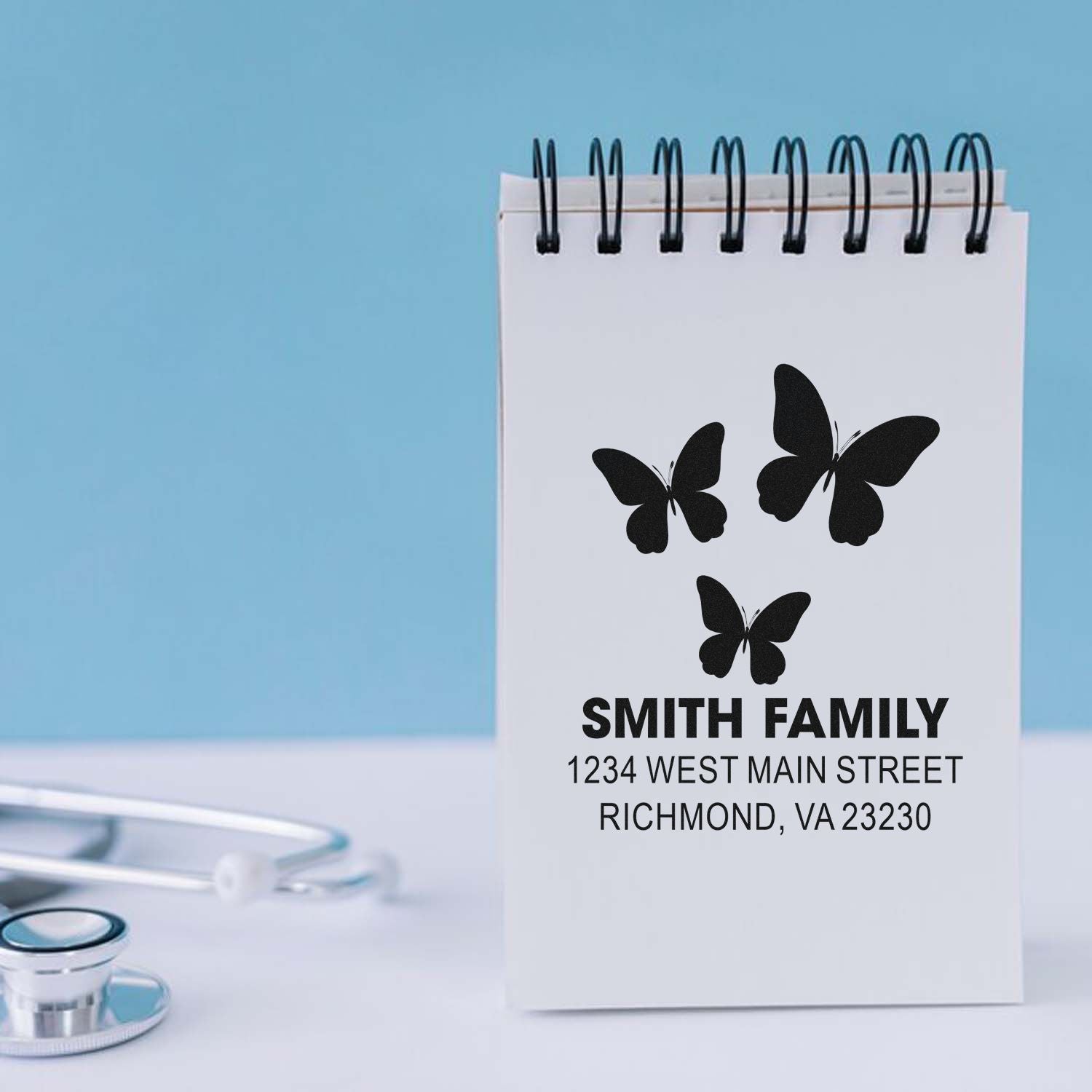 Custom family address rubber stamp with butterfly design for mailing, featuring Smith Family and Richmond, VA.