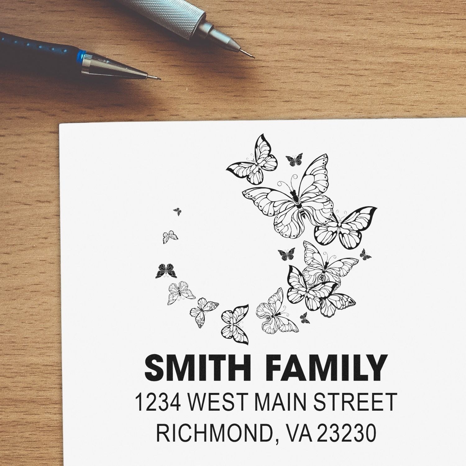 Custom butterfly return address rubber stamp for Smith family, featuring name and Richmond, VA address.