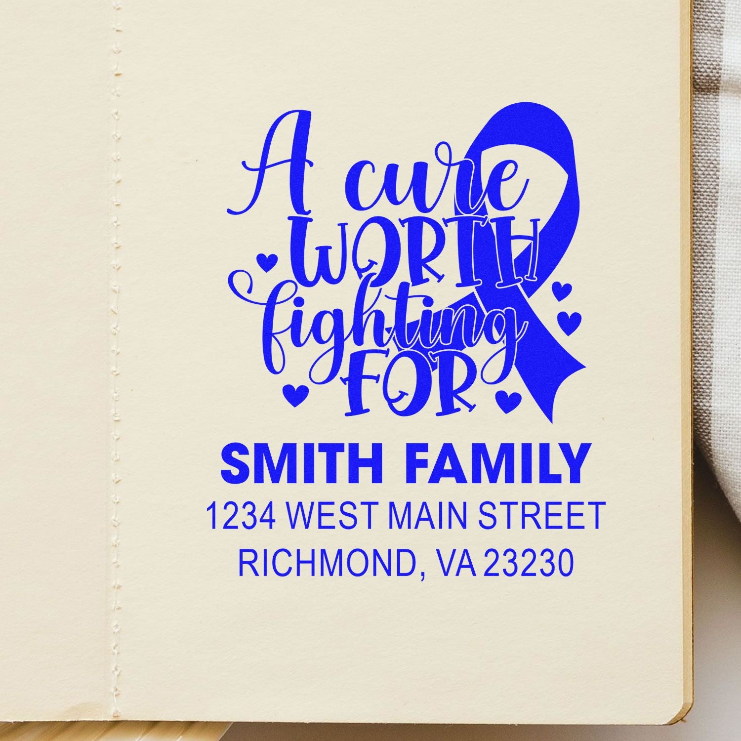 Custom awareness ribbon rubber stamp with A Cure Worth Fighting For, Smith Family name, and return address.