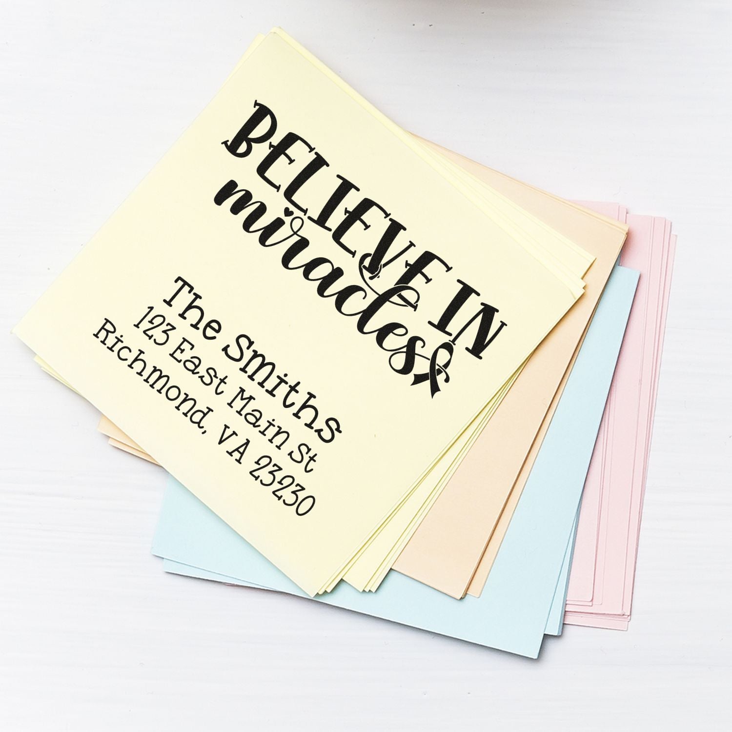 Custom rubber address stamp sample with Believe in miracles design, ideal for wedding invitations and personalized stationery.