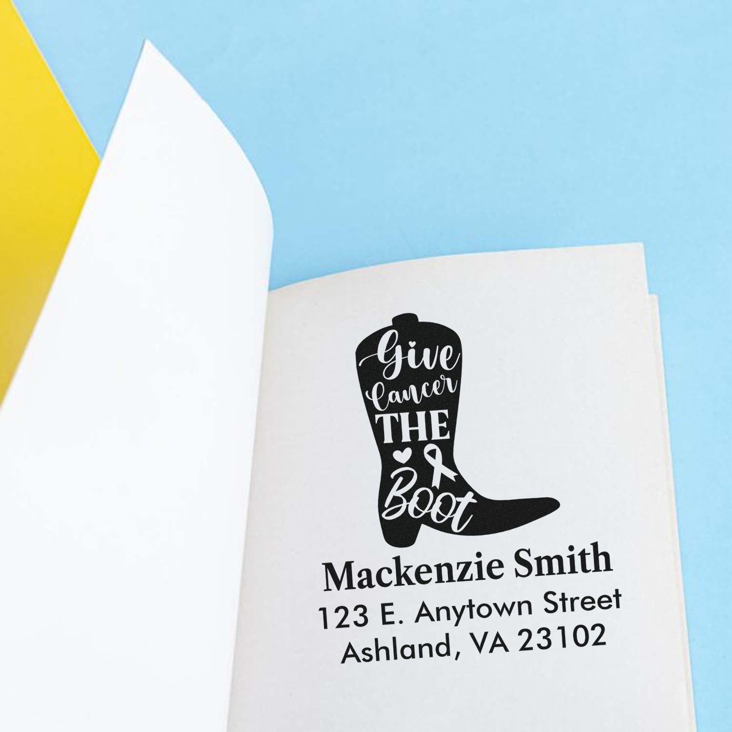 Custom rubber stamp with Give Cancer the Boot boot design, personalized with name and address for cancer awareness mailings.