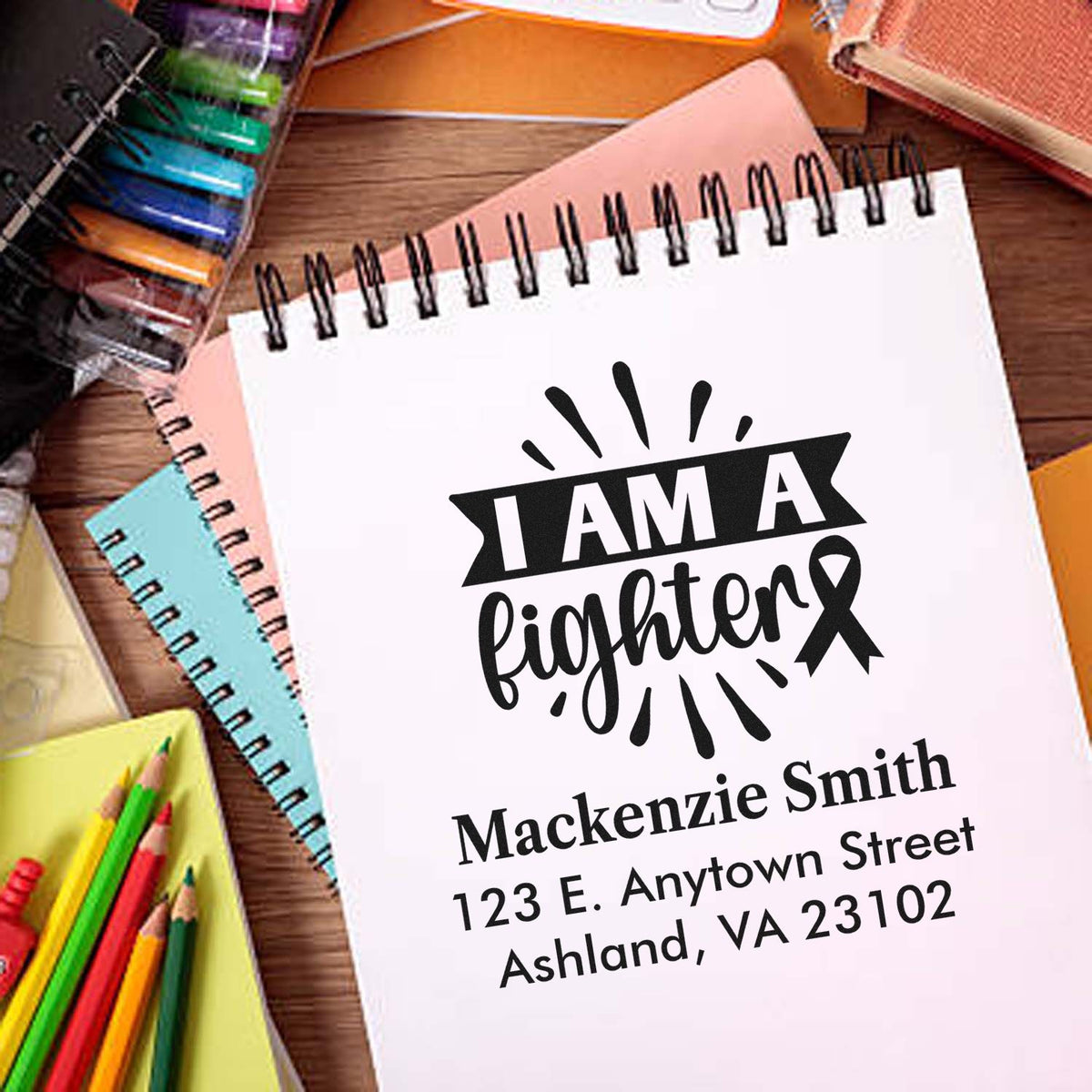 Custom rubber stamp mockup with I AM A Fighter breast cancer awareness design and personalized name and address.