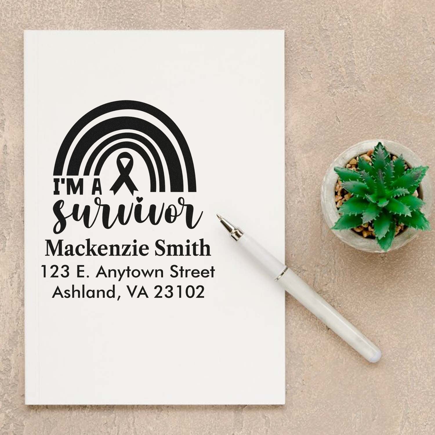Custom rubber address stamp with Im a Survivor rainbow ribbon design and personalized name and address.