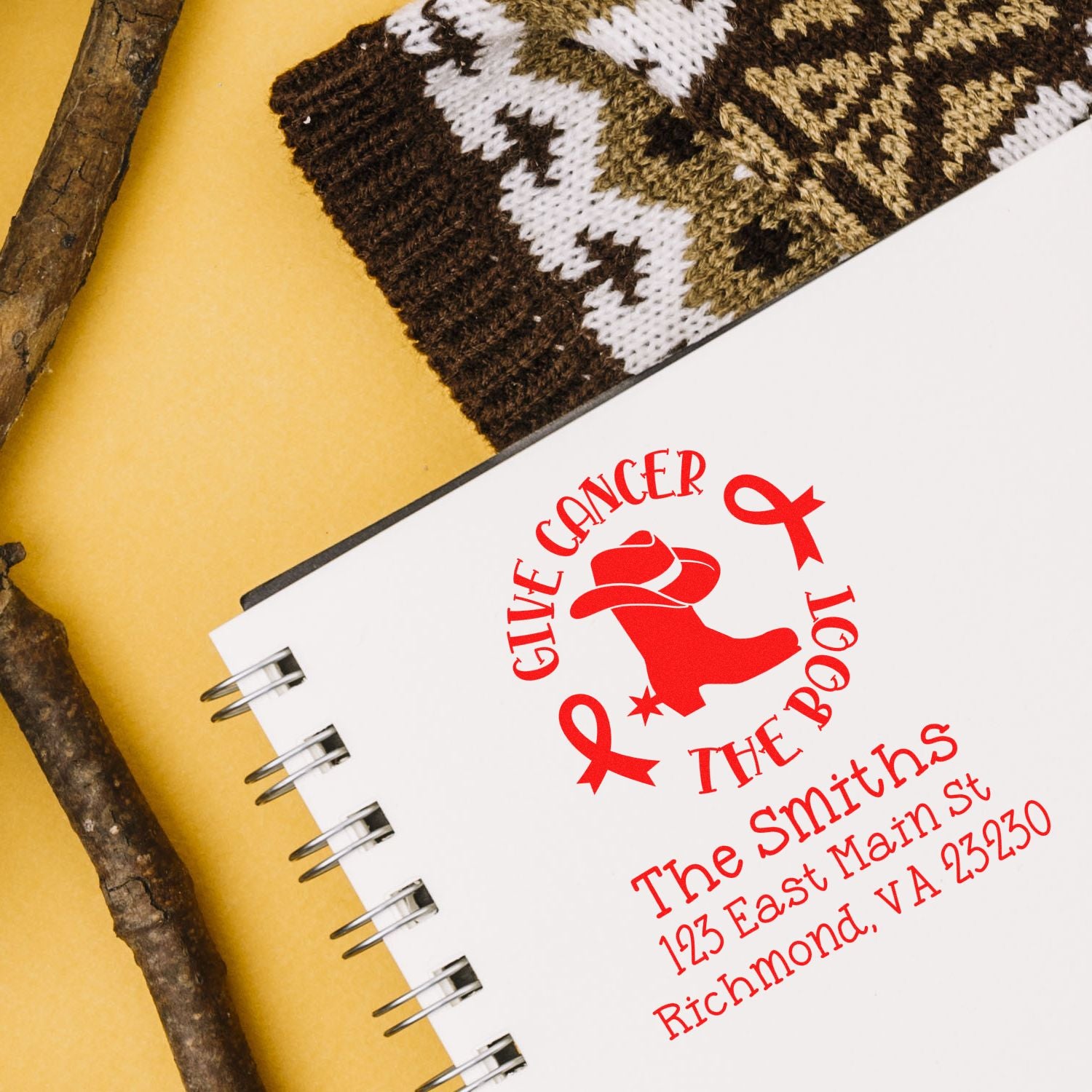 Red rubber stamp design reading Give Cancer the Boot with boot and ribbon for cancer awareness stationery and packaging.