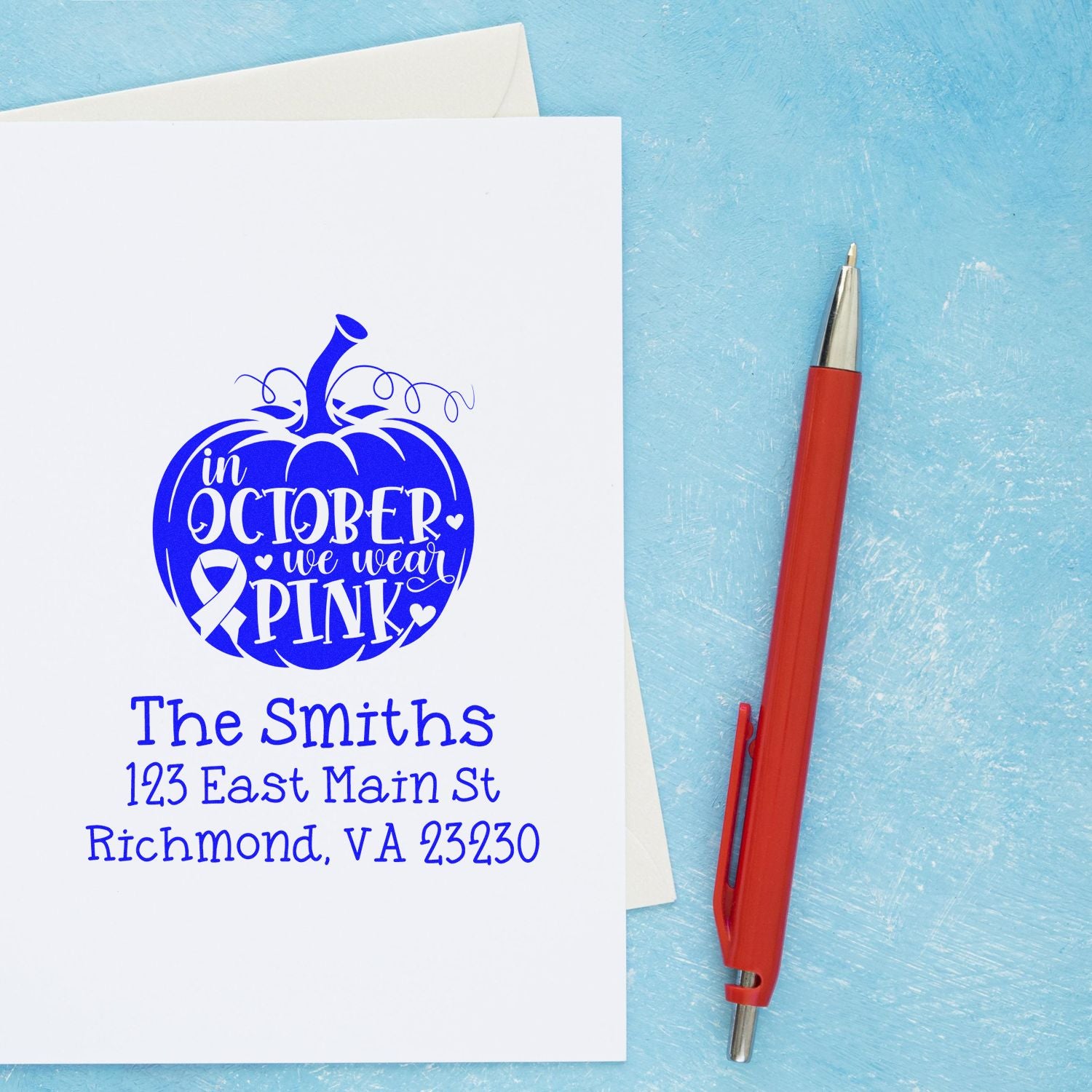 Custom October We Wear Pink pumpkin rubber stamp with name and return address for breast cancer awareness cards.