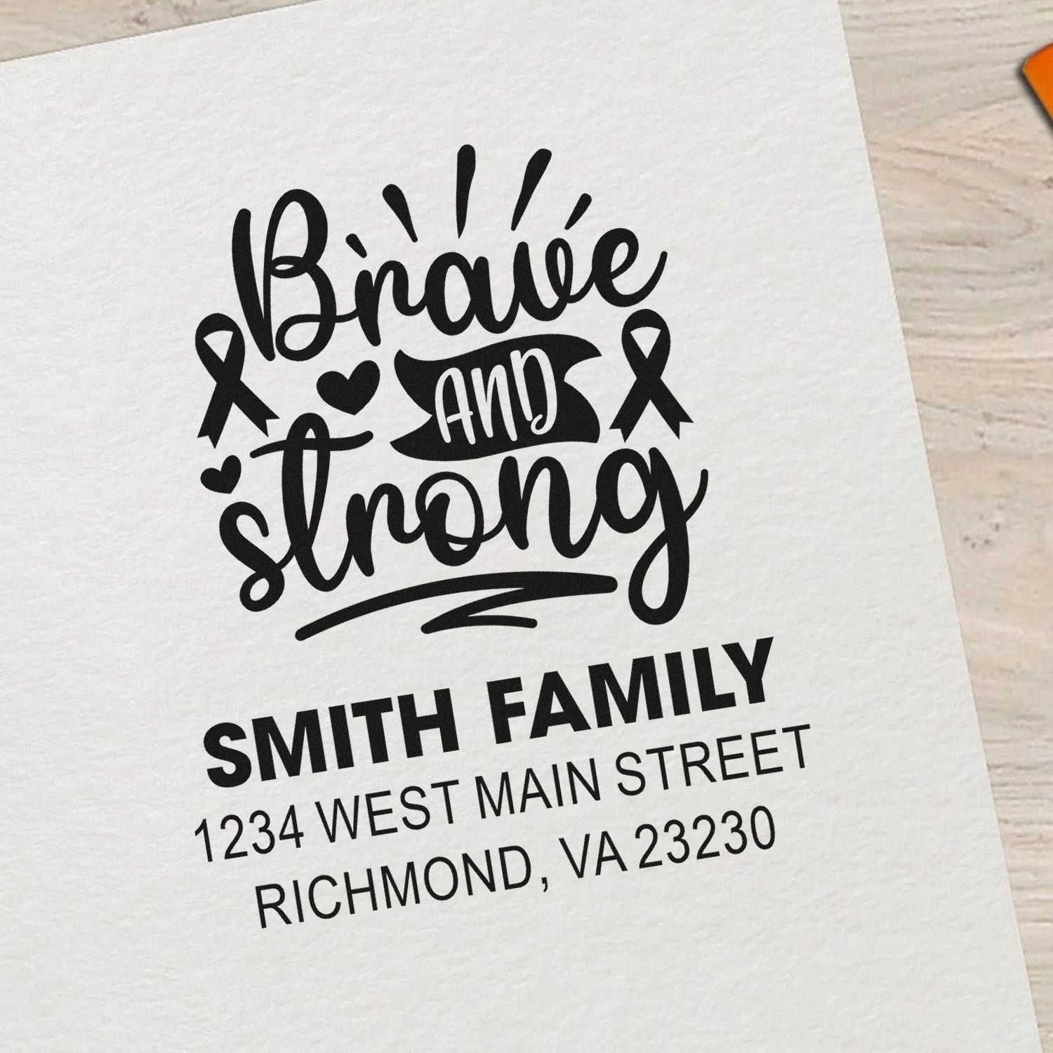 Custom Brave and Strong address rubber stamp with family name, awareness ribbons, and hearts for supportive mailings.