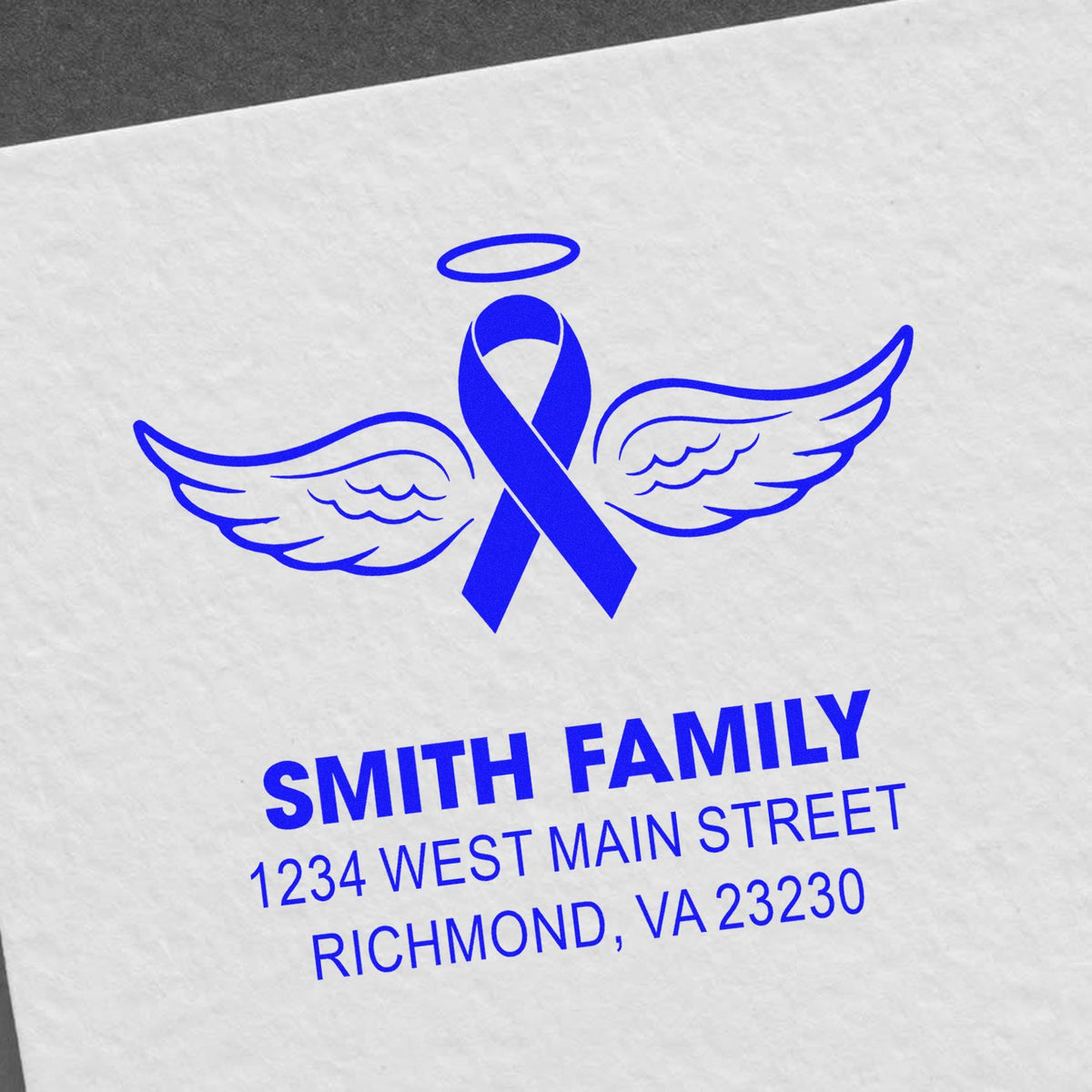 Personalized sympathy rubber stamp with angel ribbon wings and Smith Family return address in blue.