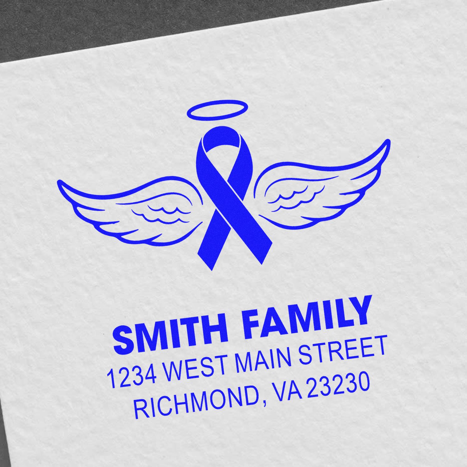 Custom memorial rubber stamp with angel ribbon wings and Smith family return address in Richmond, VA.