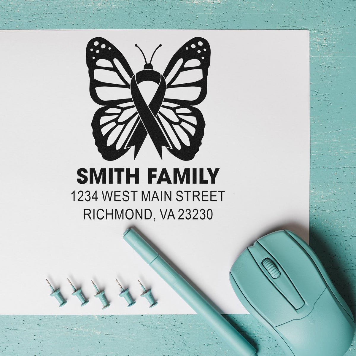 Custom self-inking butterfly ribbon address stamp with Smith Family return address, ideal for breast cancer awareness mailings.