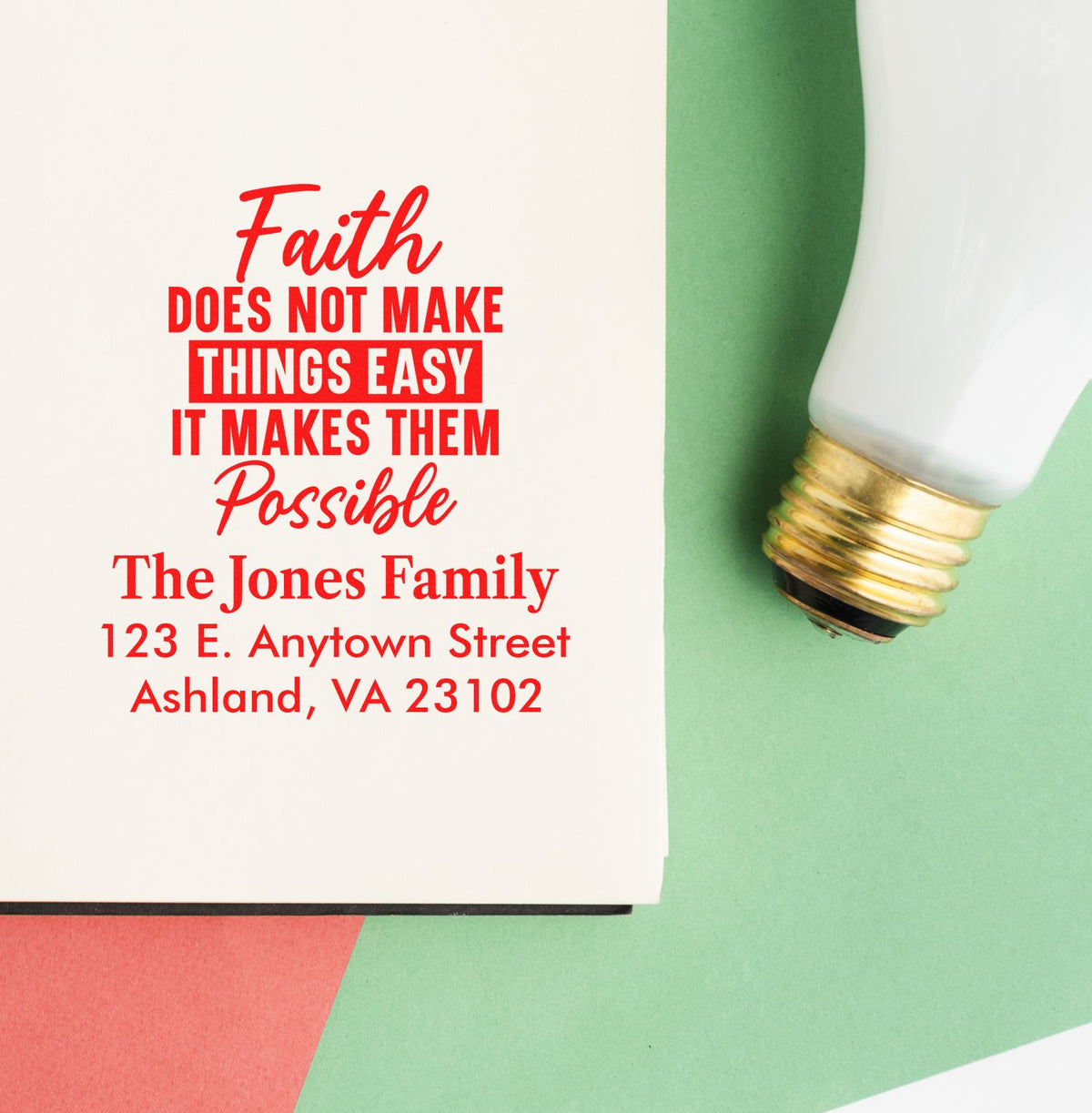 Custom rubber stamp with faith quote and family return address, shown beside a stamped impression for personalized stationery.