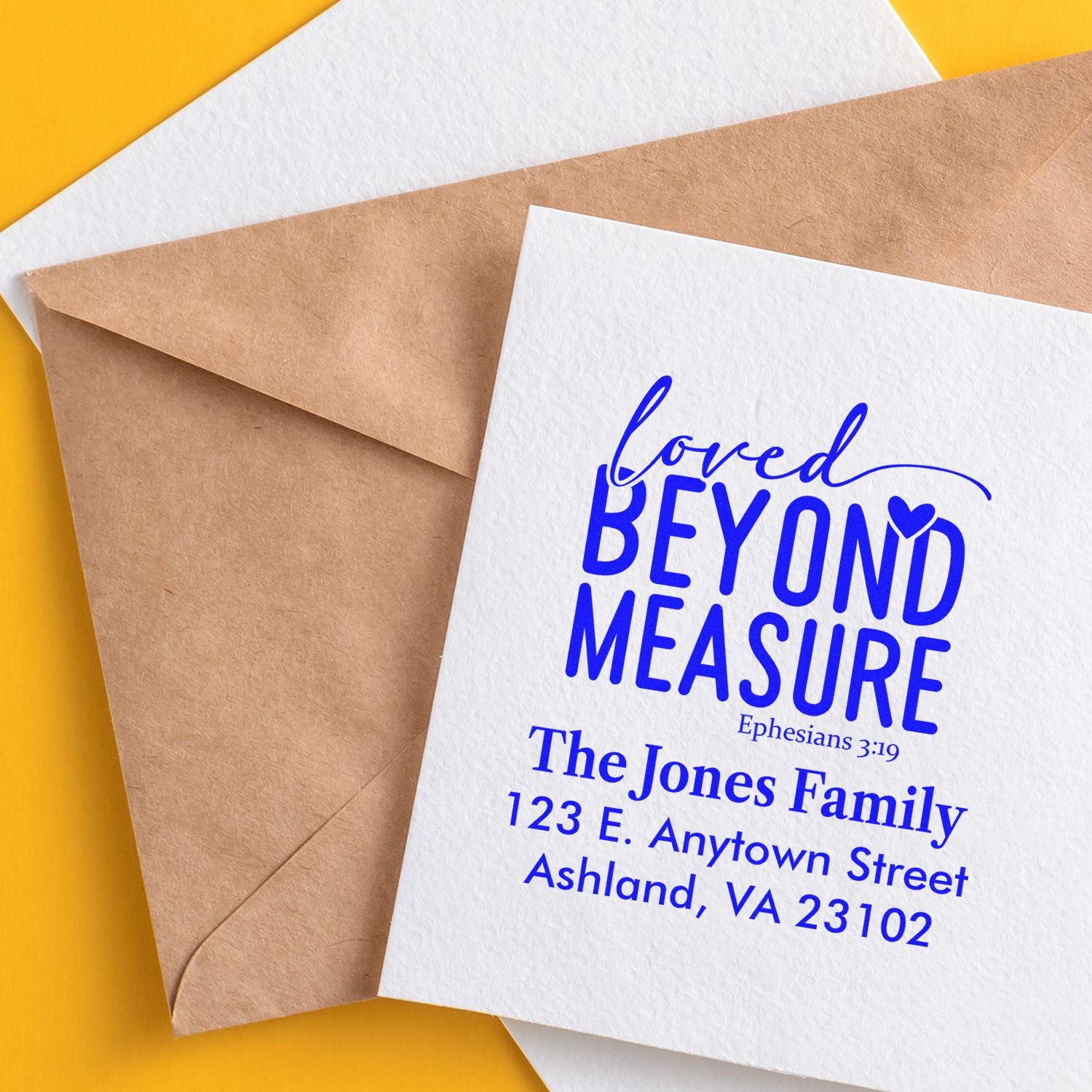 Custom rubber stamp with Bible verse, family name, and return address for faith-inspired stationery and envelopes.