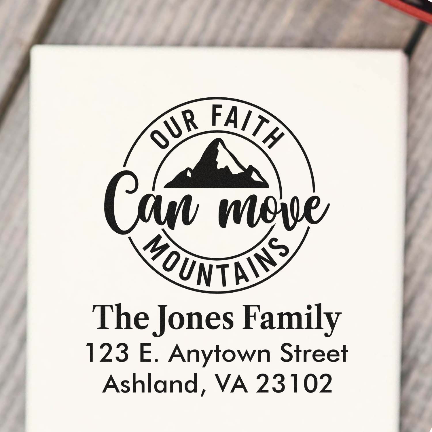 Personalized rubber address stamp for The Jones Family with Our Faith Can Move Mountains mountain logo.