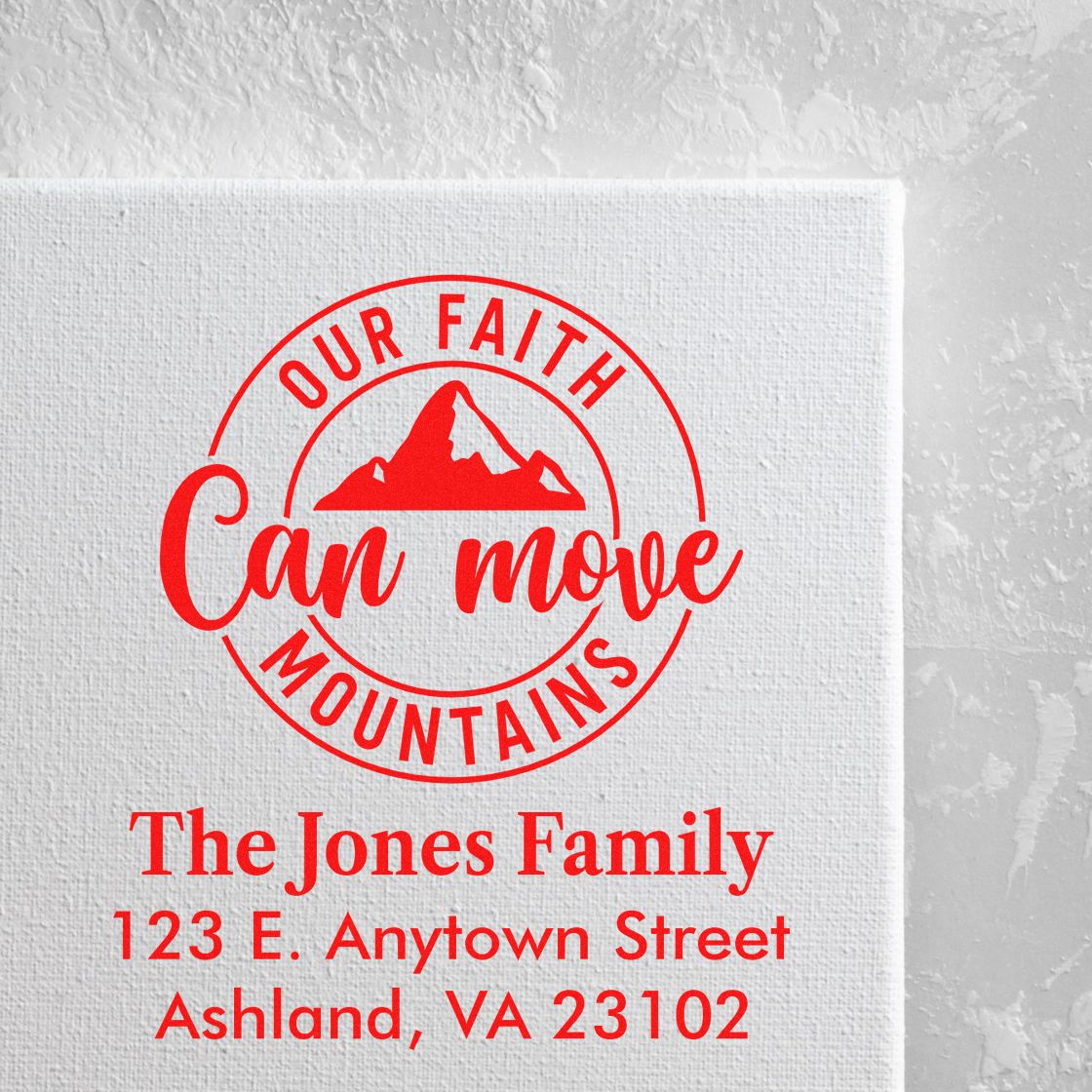 Custom family rubber stamp with Our Faith Can Move Mountains mountain logo and The Jones Family address in red ink.