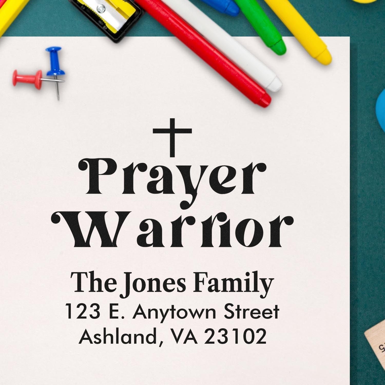 Custom rubber stamp with cross and Prayer Warrior text, personalized for The Jones Family with address details.