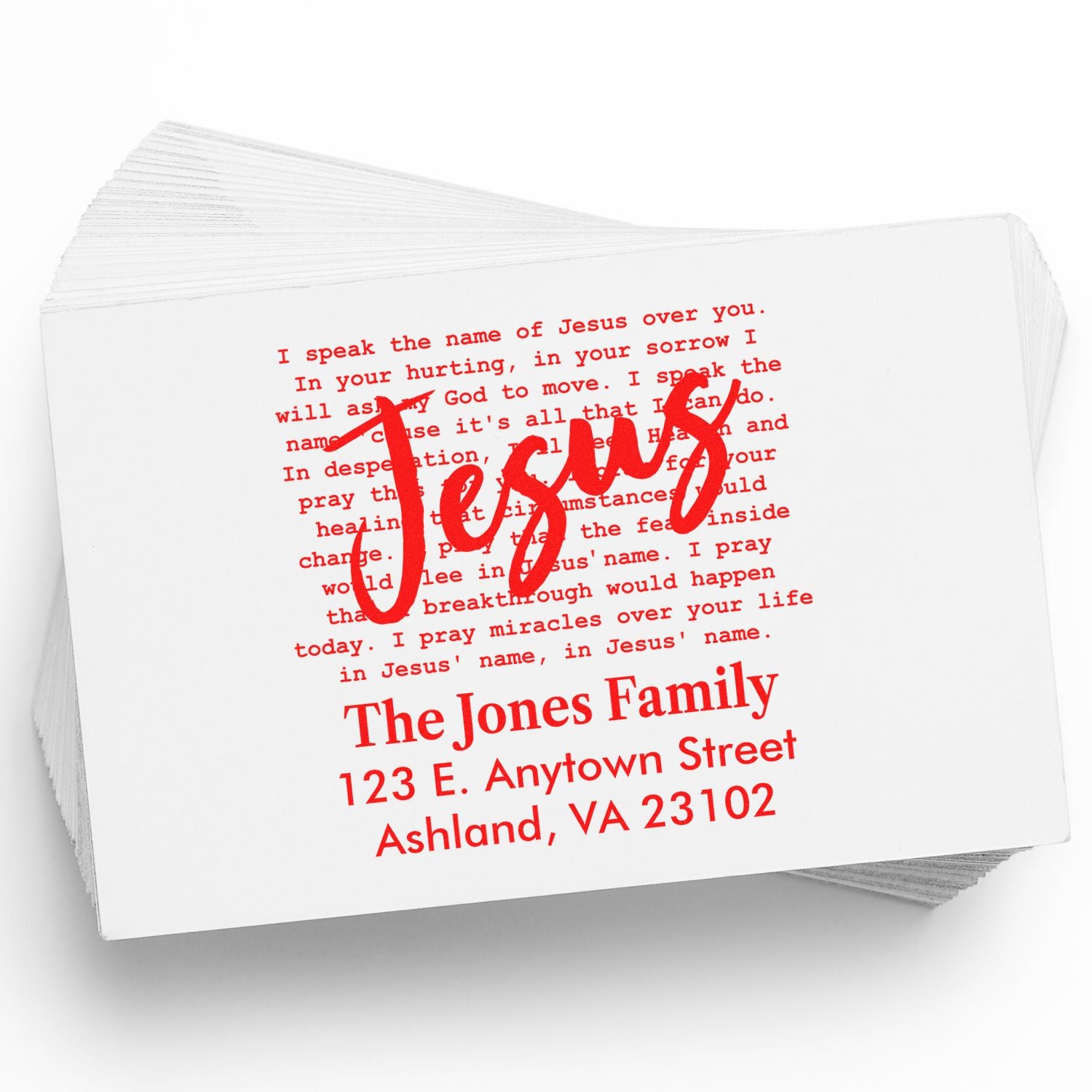 Custom Christian rubber stamp with red Jesus design and family return address on blank cards.