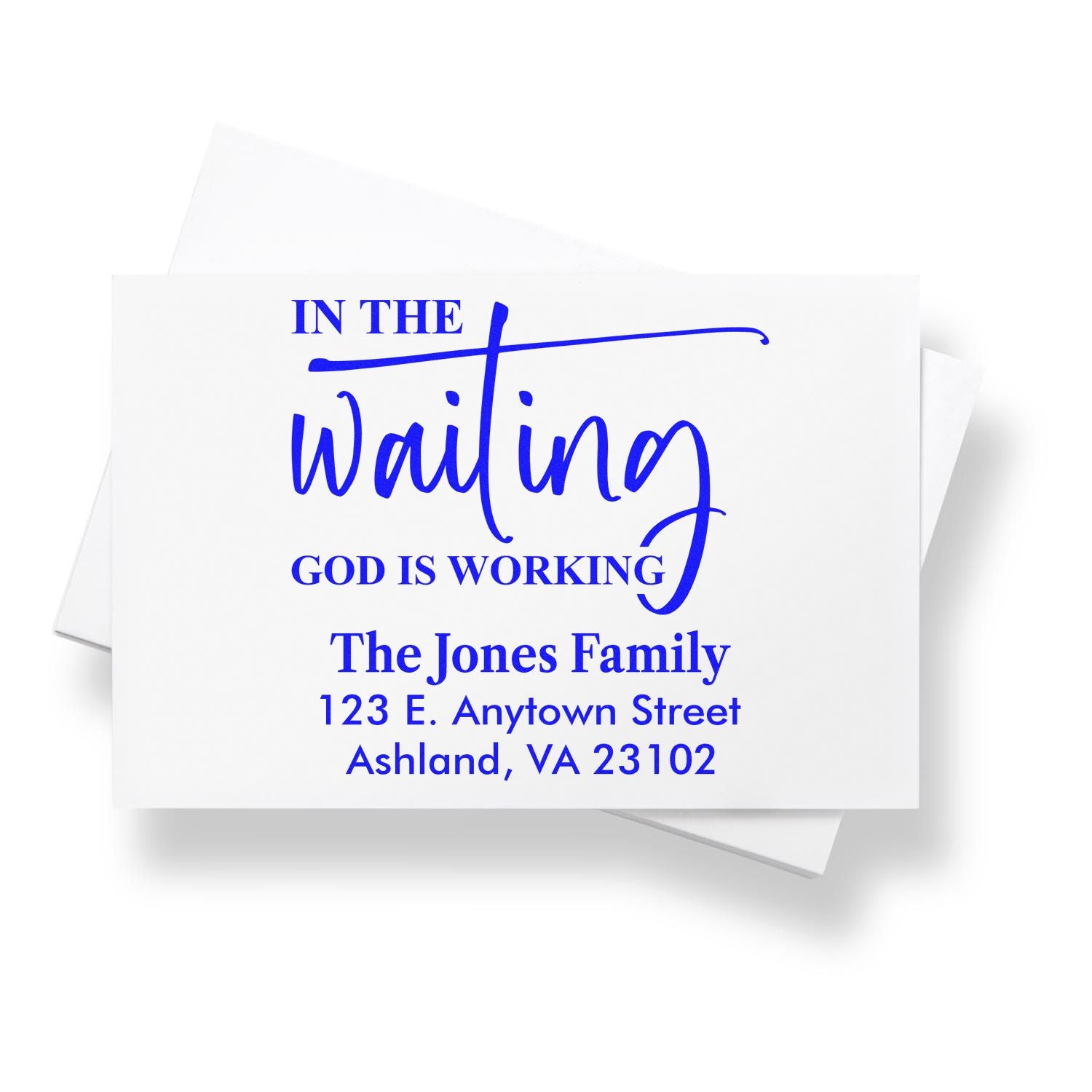 Custom religious return address rubber stamp with In the Waiting, God Is Working for The Jones Family in blue script.